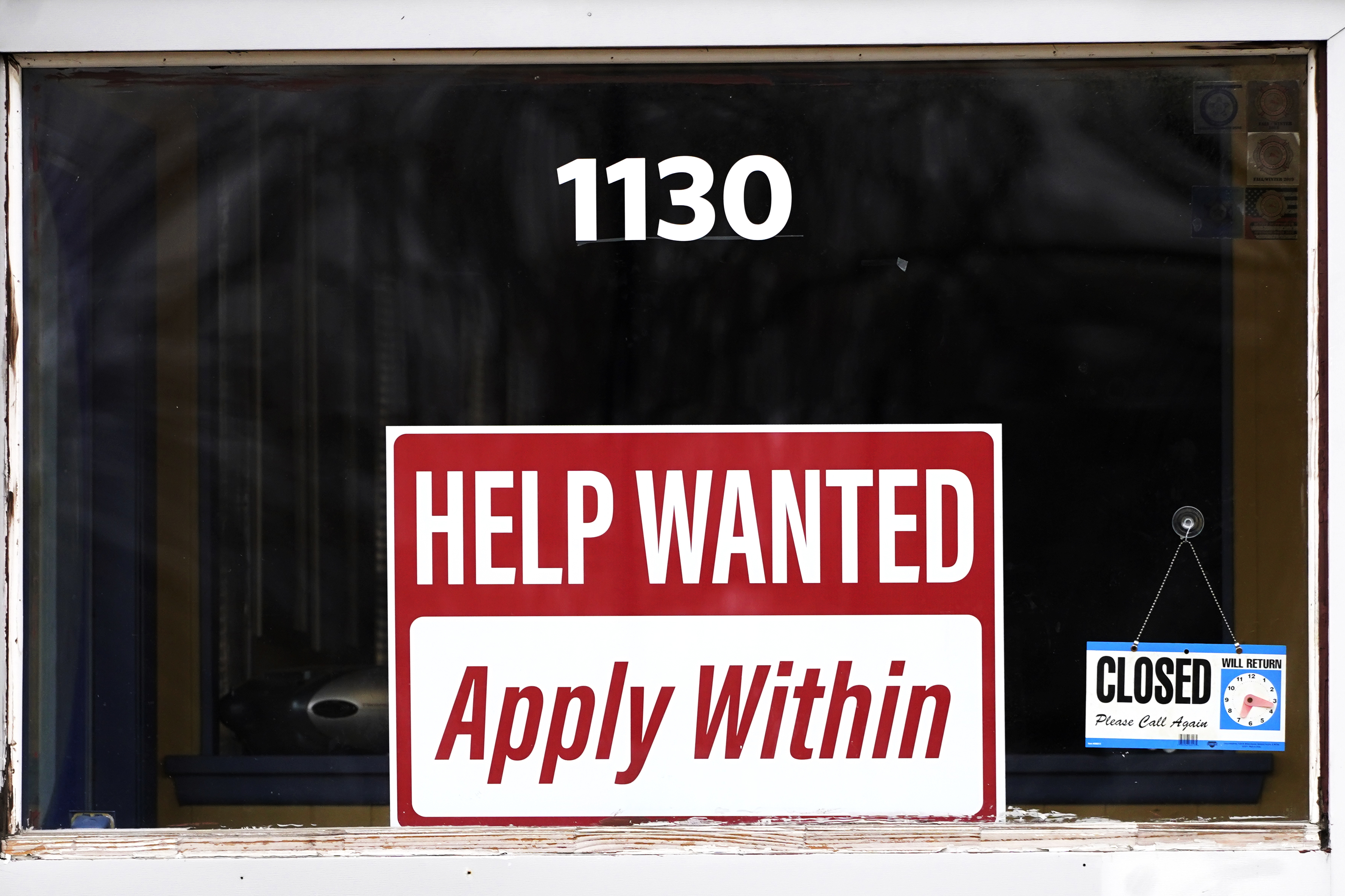 FILE - A "help wanted" sign is seen at an Allstate insurance office in Elgin, Ill., March 19, 2022. (AP Photo/Nam Y. Huh, File)