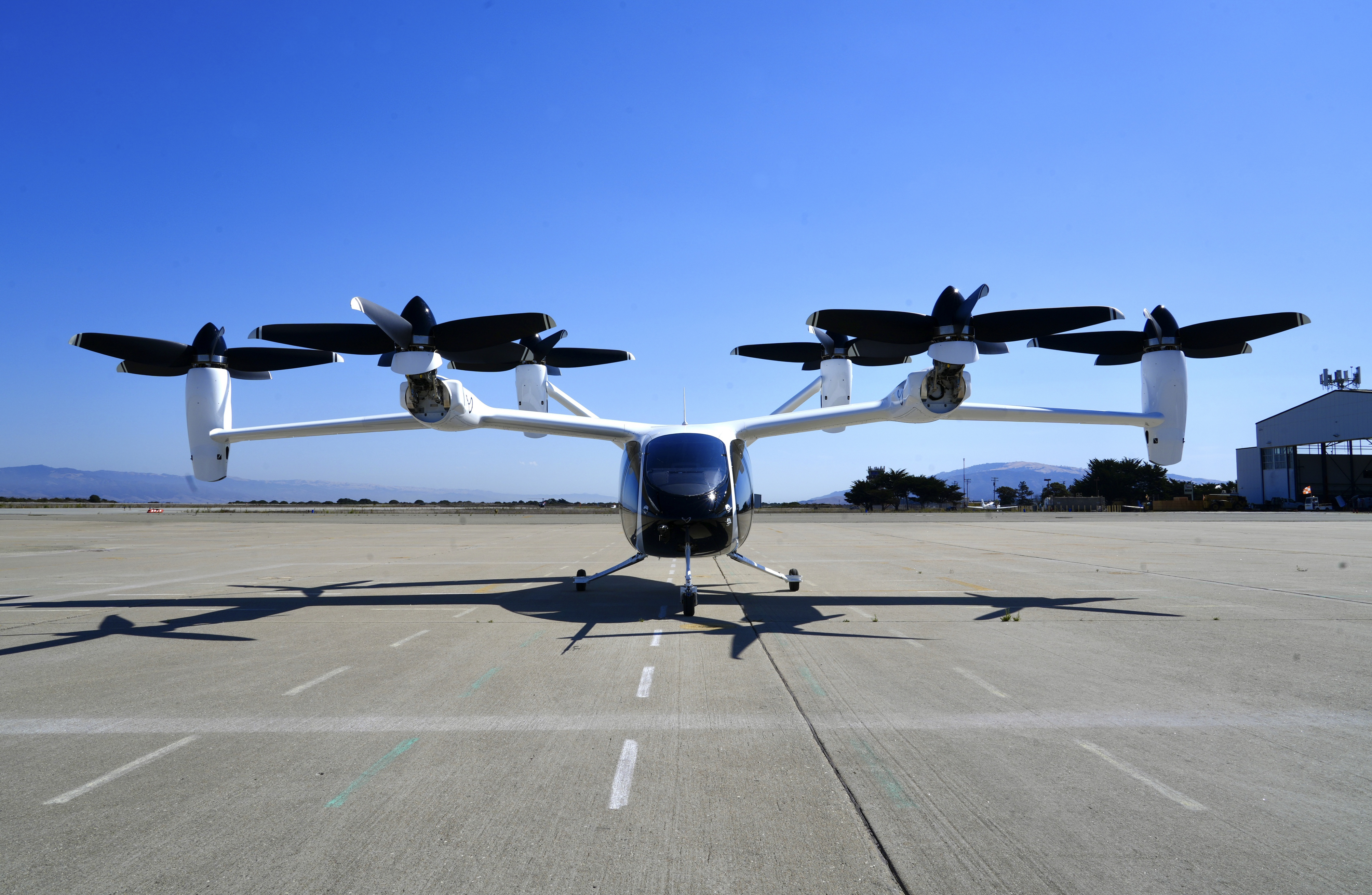 An "electric vertical take-off and landing" aircraft built by Joby Aviation is parked at an airfield in Marina, Calif. on Monday, Oct. 7, 2024. (AP Photo/Terry Chea)