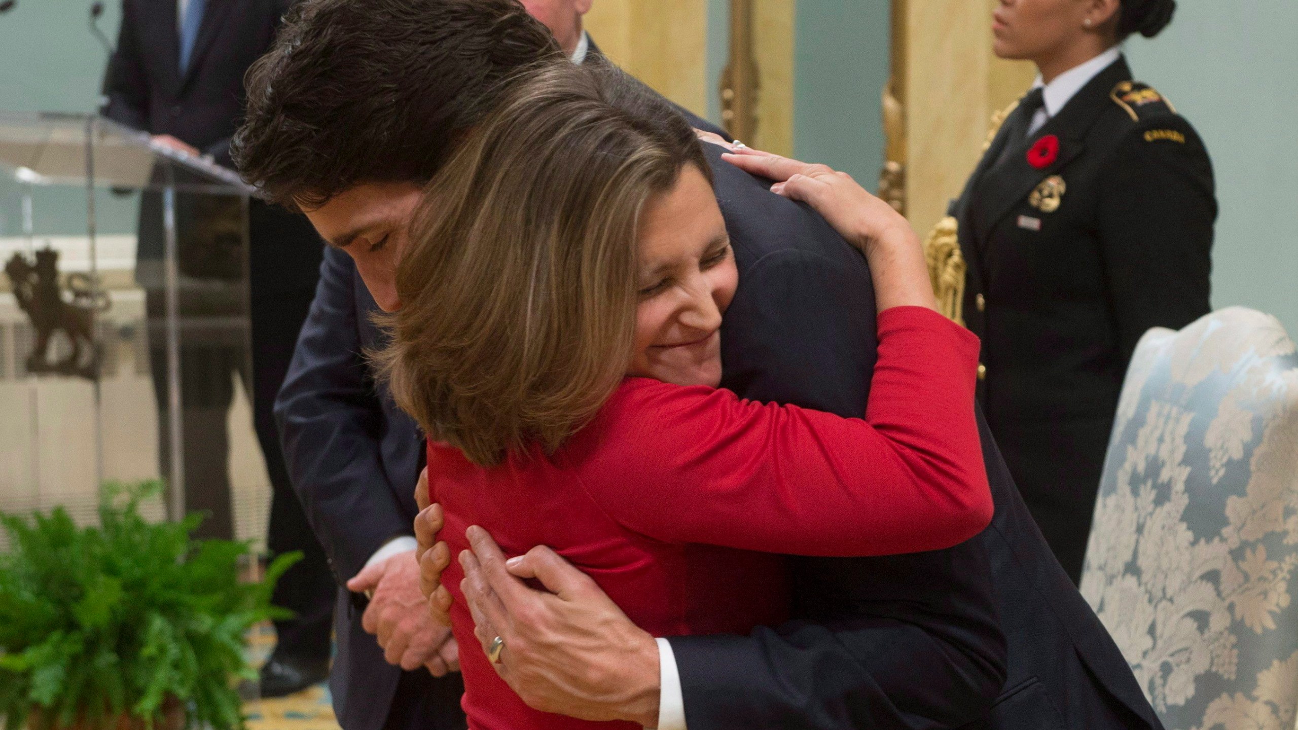 FILE - Minister of International Trade Chrystia Freeland gives Prime Minister Justin Trudeau a hug after being sworn in during ceremonies at Rideau Hall, on Nov. 4, 2015, in Ottawa. (Adrian Wyld/The Canadian Press via AP, File)