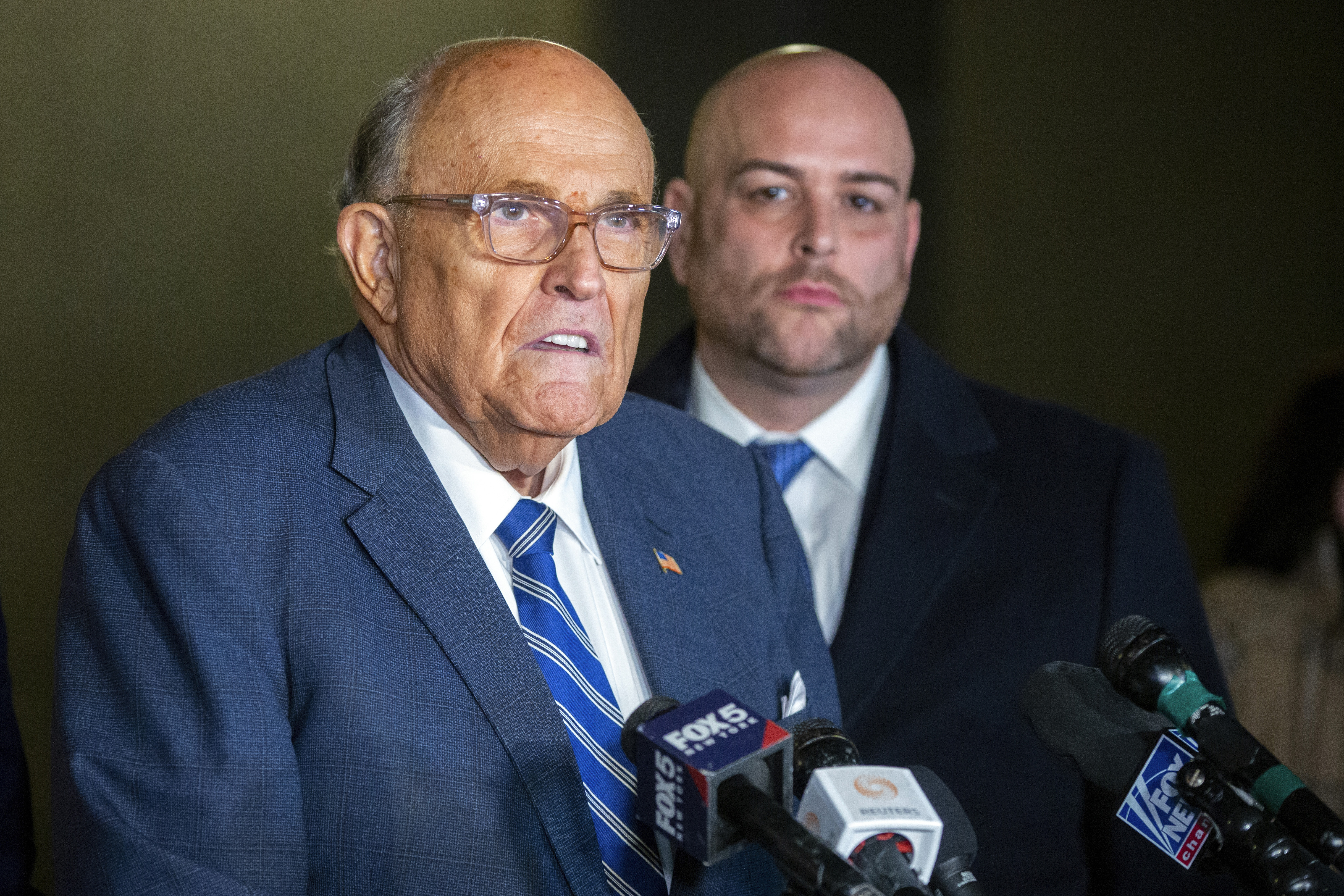 Rudy Giuliani speaks to the media outside Manhattan federal court in New York after testifying in a contempt hearing, Friday, Jan. 3, 2025. (AP Photo/Ted Shaffrey)