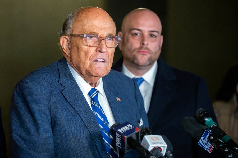 Rudy Giuliani speaks to the media outside Manhattan federal court in New York after testifying in a contempt hearing, Friday, Jan. 3, 2025. (AP Photo/Ted Shaffrey)