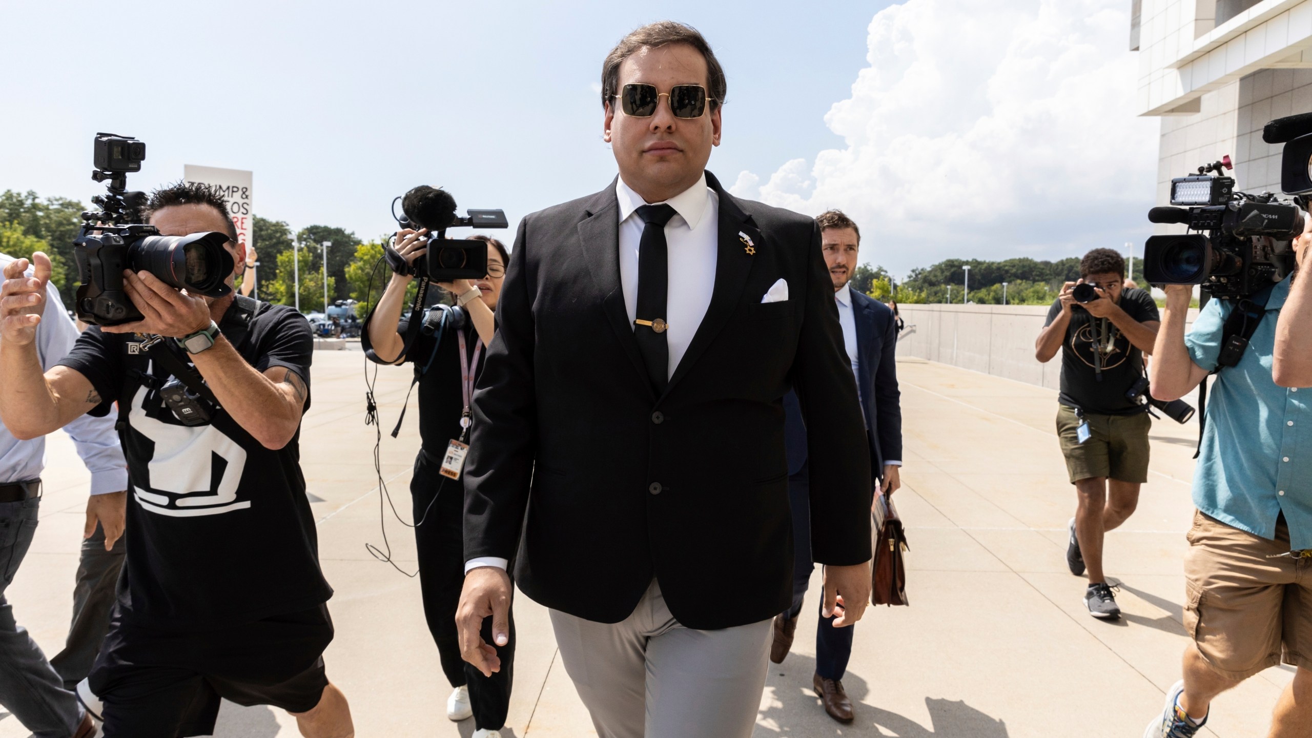 FILE - Former U.S. Rep. George Santos arrives at court in Central Islip, N.Y., Monday, Aug. 19, 2024. (AP Photo/Stefan Jeremiah, File)