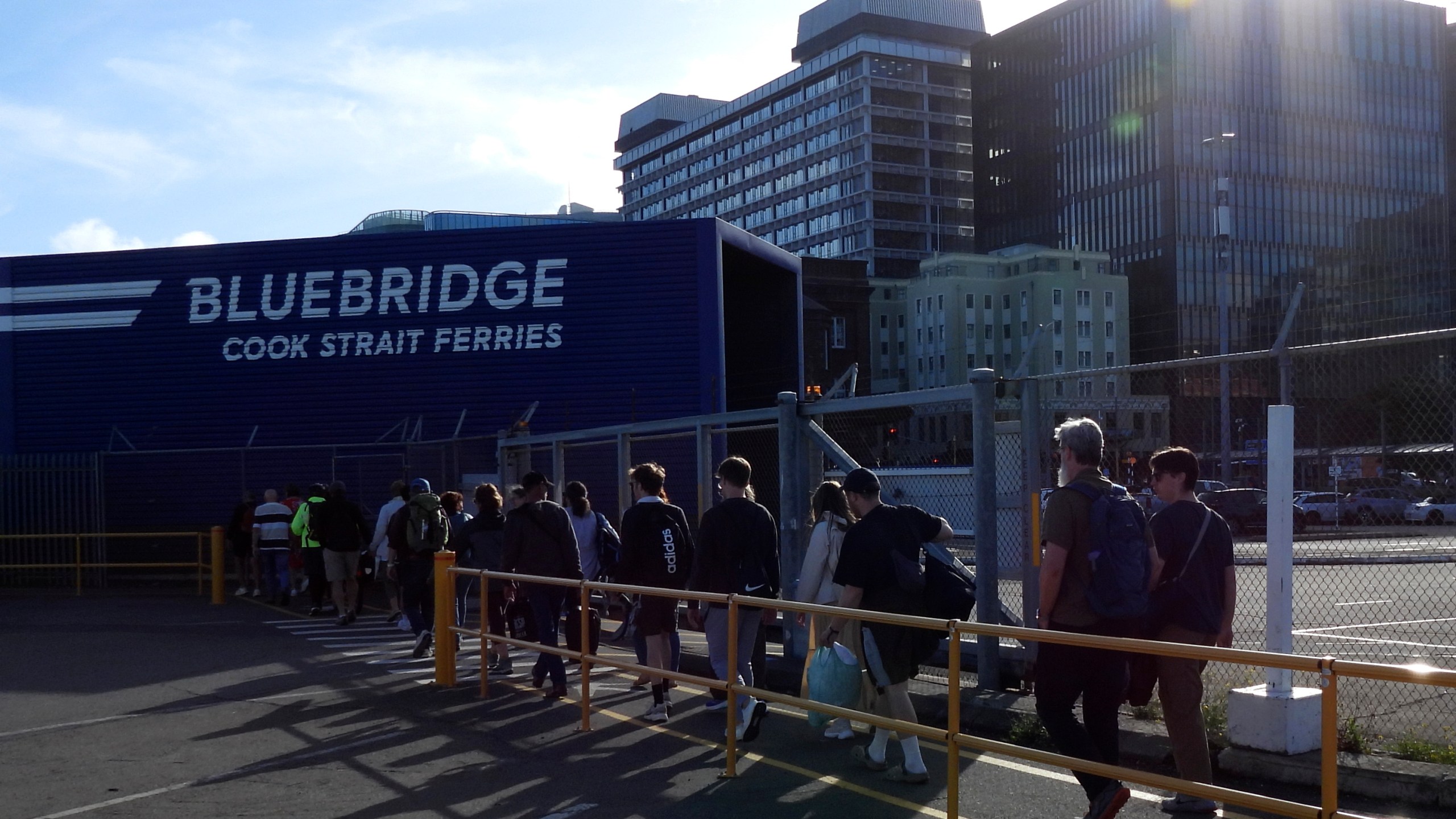 Bluebridge ferry passengers disembark in Wellington, New Zealand, on Tuesday, Jan. 7, 2025. (AP Photo/Charlotte Graham-McLay)