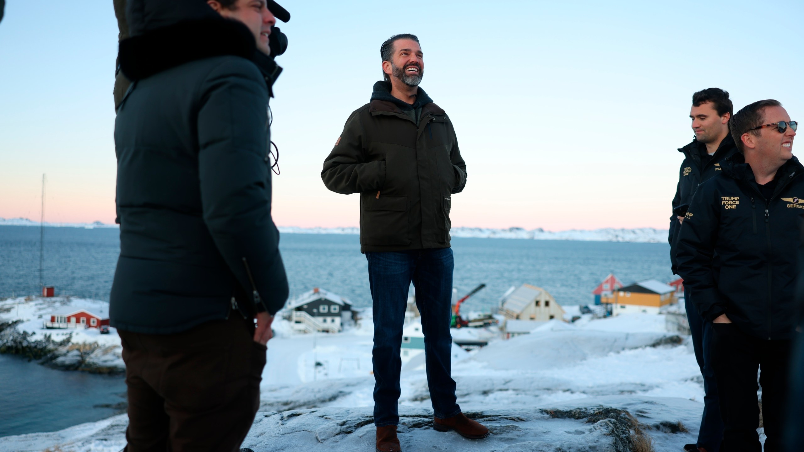 Donald Trump Jr., center, smiles after arriving in Nuuk, Greenland, Tuesday, Jan. 7, 2025. (Emil Stach/Ritzau Scanpix via AP)