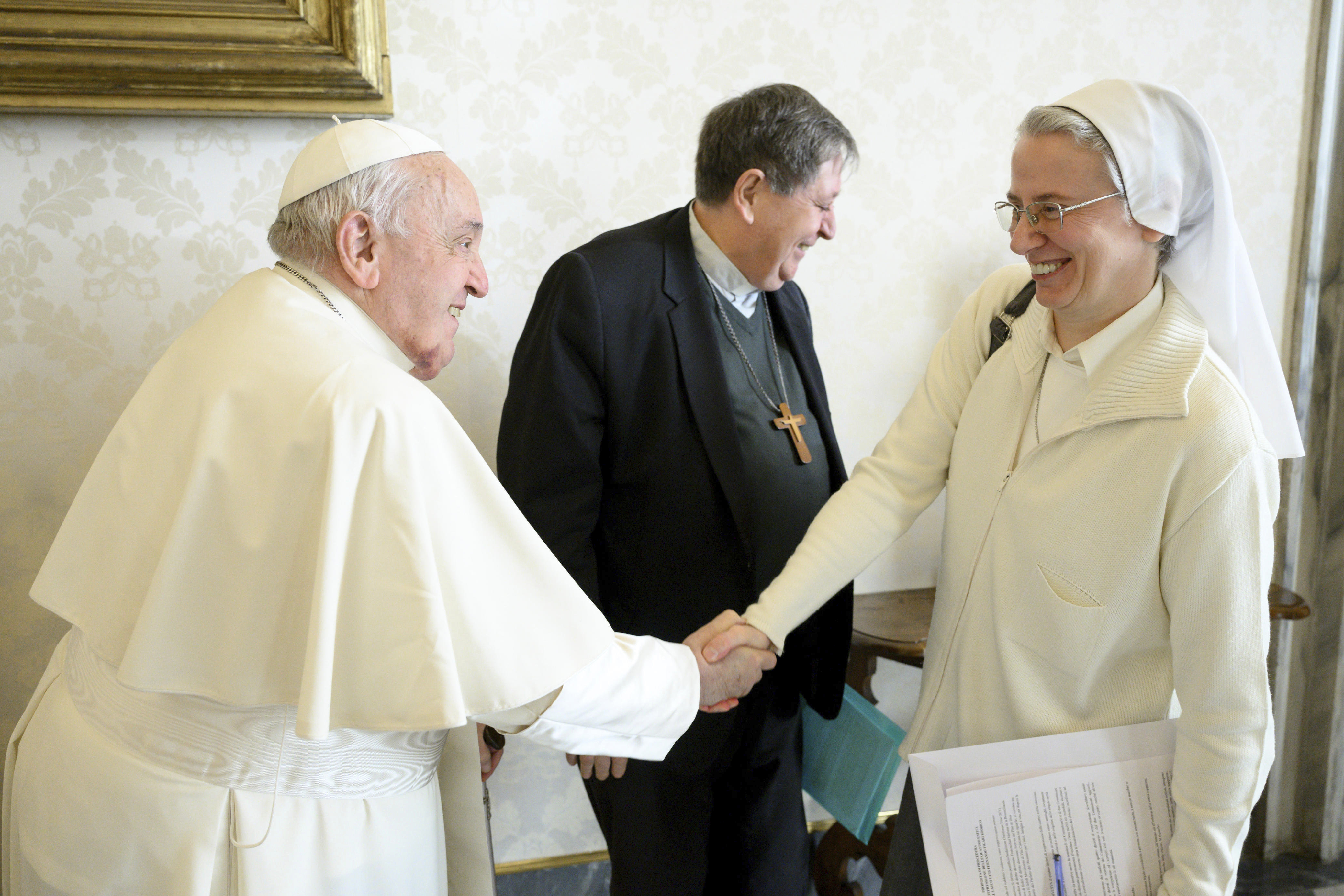 This image released on Wednesday Jan. 8, 2025 by the Vatican Media shows Pope Francis shaking hands with Sister Simona Brambilla, an Italian nun who is the first woman named to head a major Vatican office, the department responsible for all the church's religious orders, at the Vatican. (Vatican Media via AP)