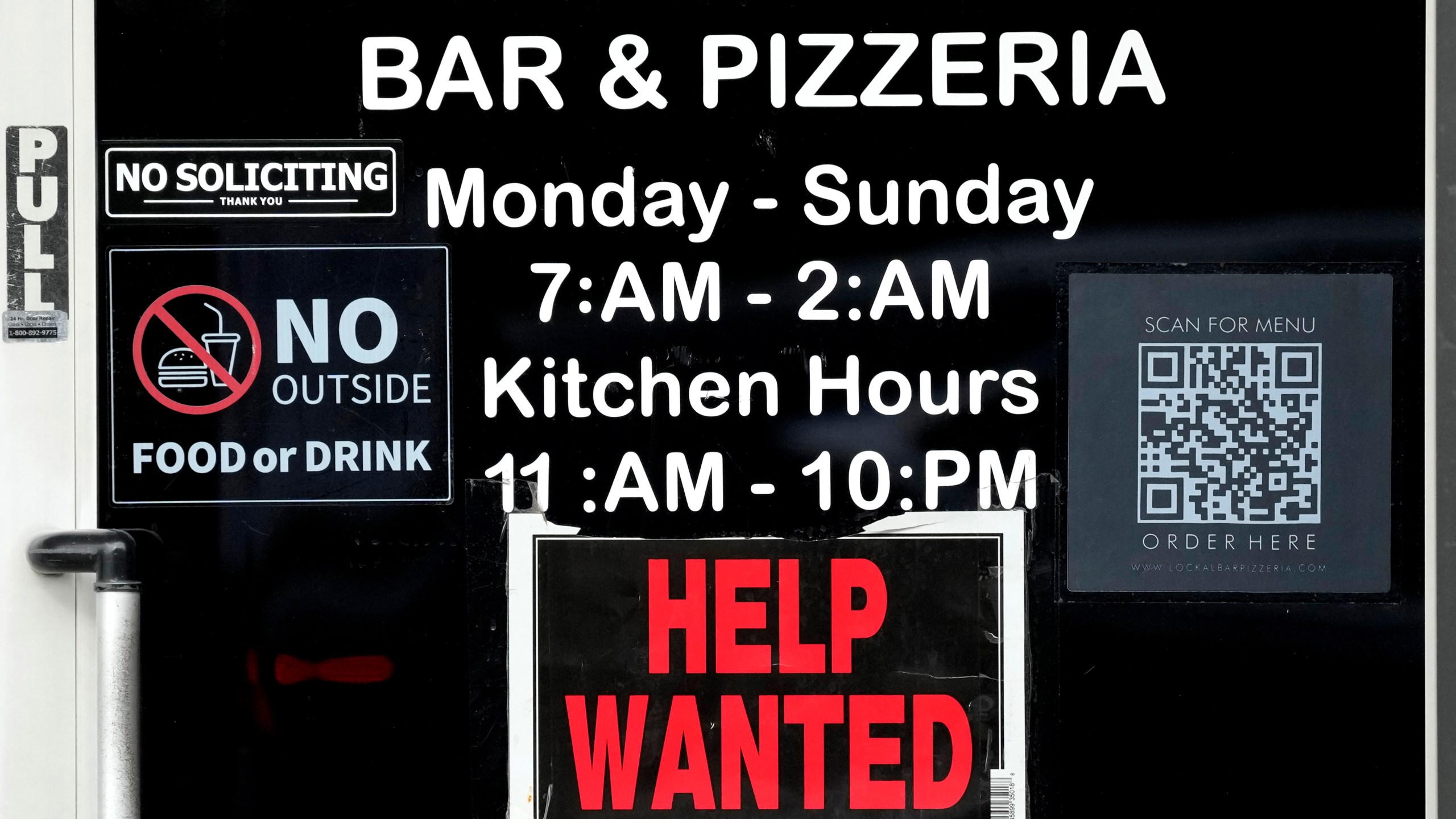 FILE - A help wanted sign is displayed at a restaurant in Chicago, Ill., Nov. 25, 2024. (AP Photo/Nam Y. Huh, File)