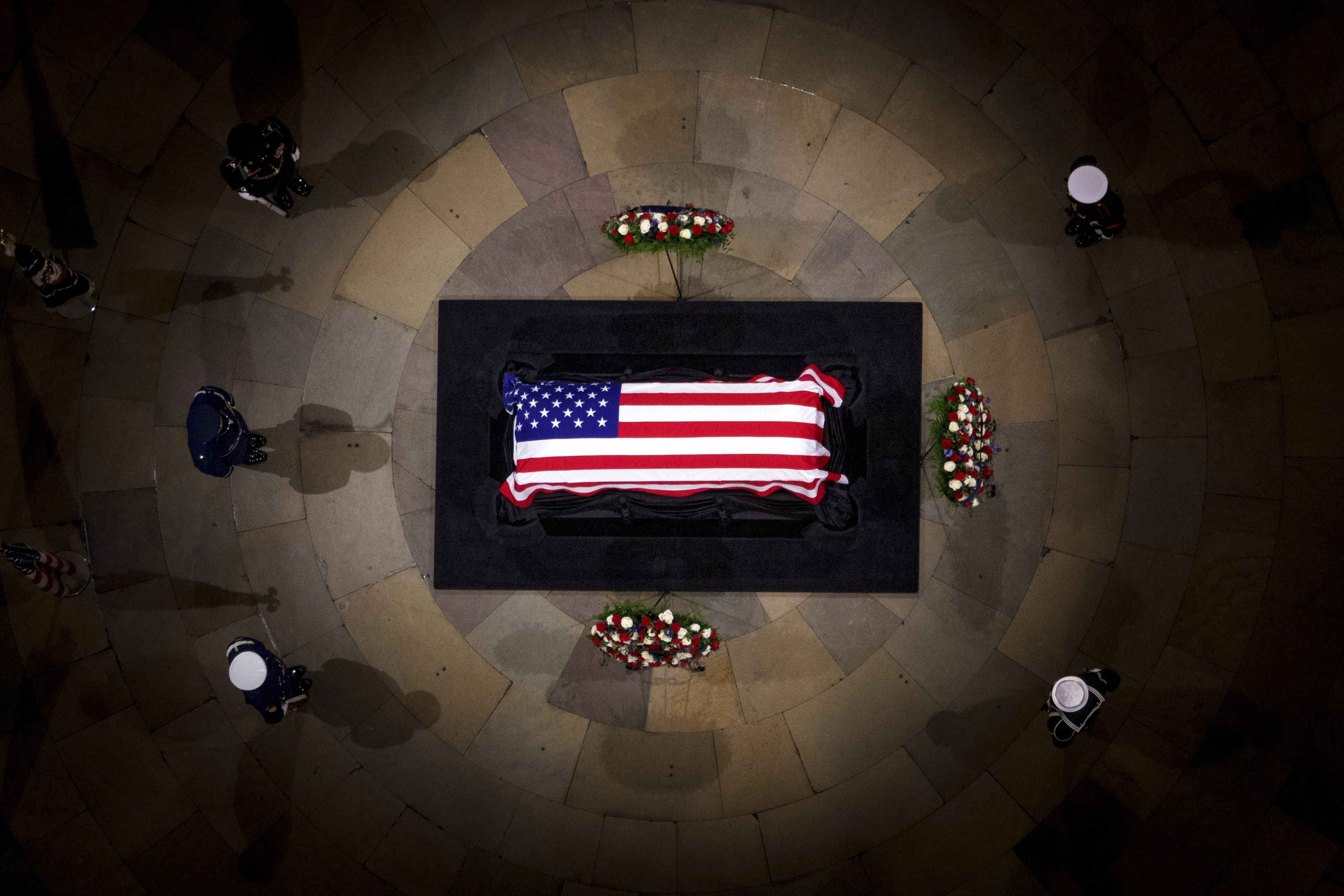 The flag-draped casket of former President Jimmy Carter lies in state at the rotunda of the U.S. Capitol Tuesday, Jan. 7, 2025, in Washington. (Andrew Harnik/Pool via AP)