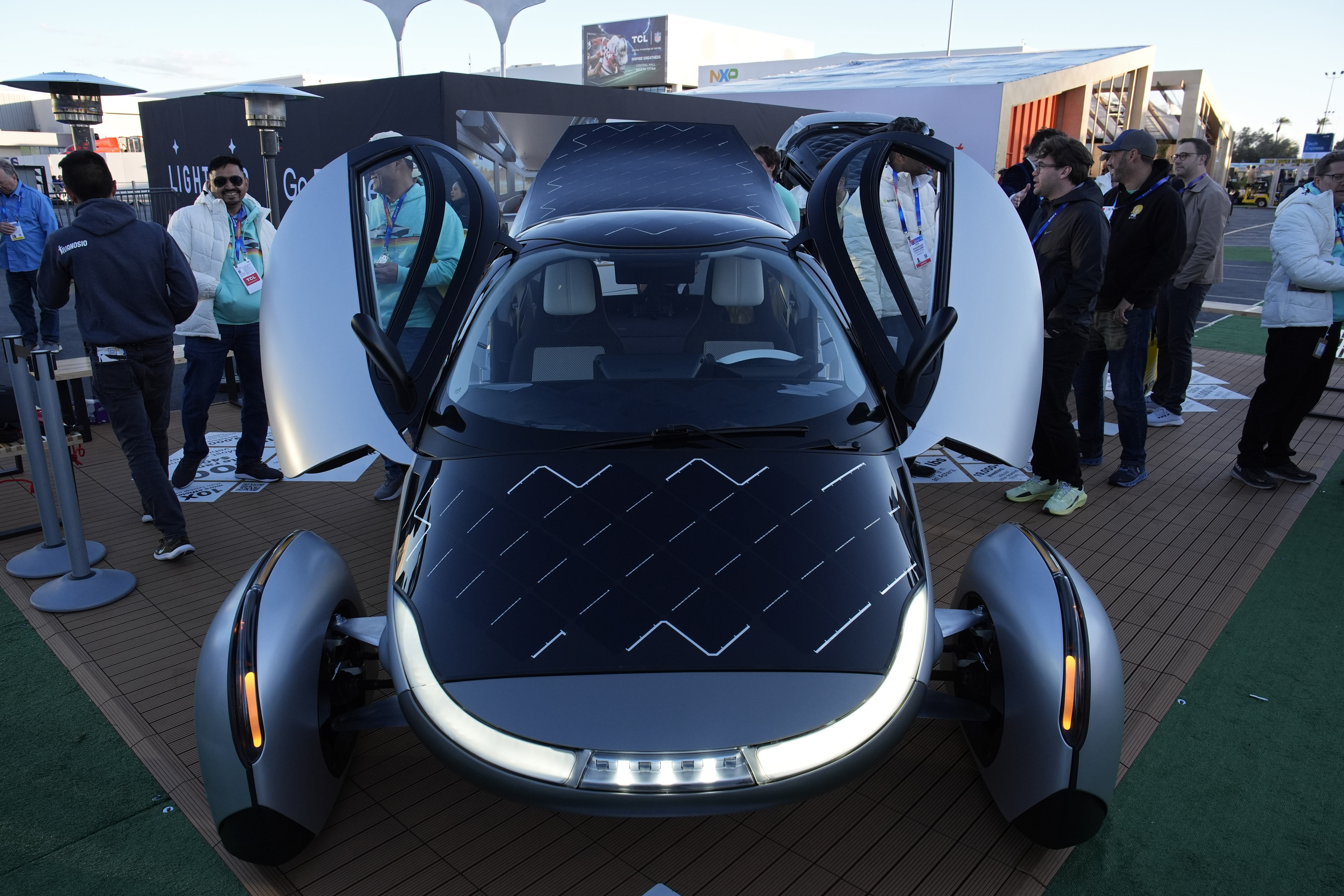 People look at a prototype solar electric vehicle by Aptera Motors during the CES tech show Tuesday, Jan. 7, 2025, in Las Vegas. (AP Photo/John Locher)