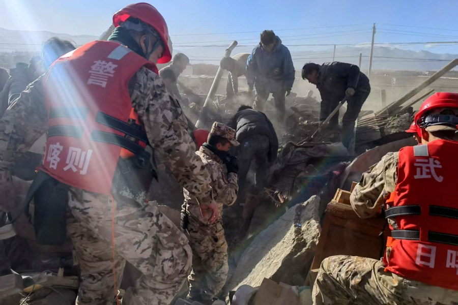 In this photo released by Xinhua News Agency, rescue workers conduct search and rescue for survivors in the aftermath of an earthquake in Changsuo Township of Dingri in Xigaze, southwestern China's Tibet Autonomous Region on Tuesday, Jan. 7, 2025. (Liu Yousheng/Xinhua via AP)