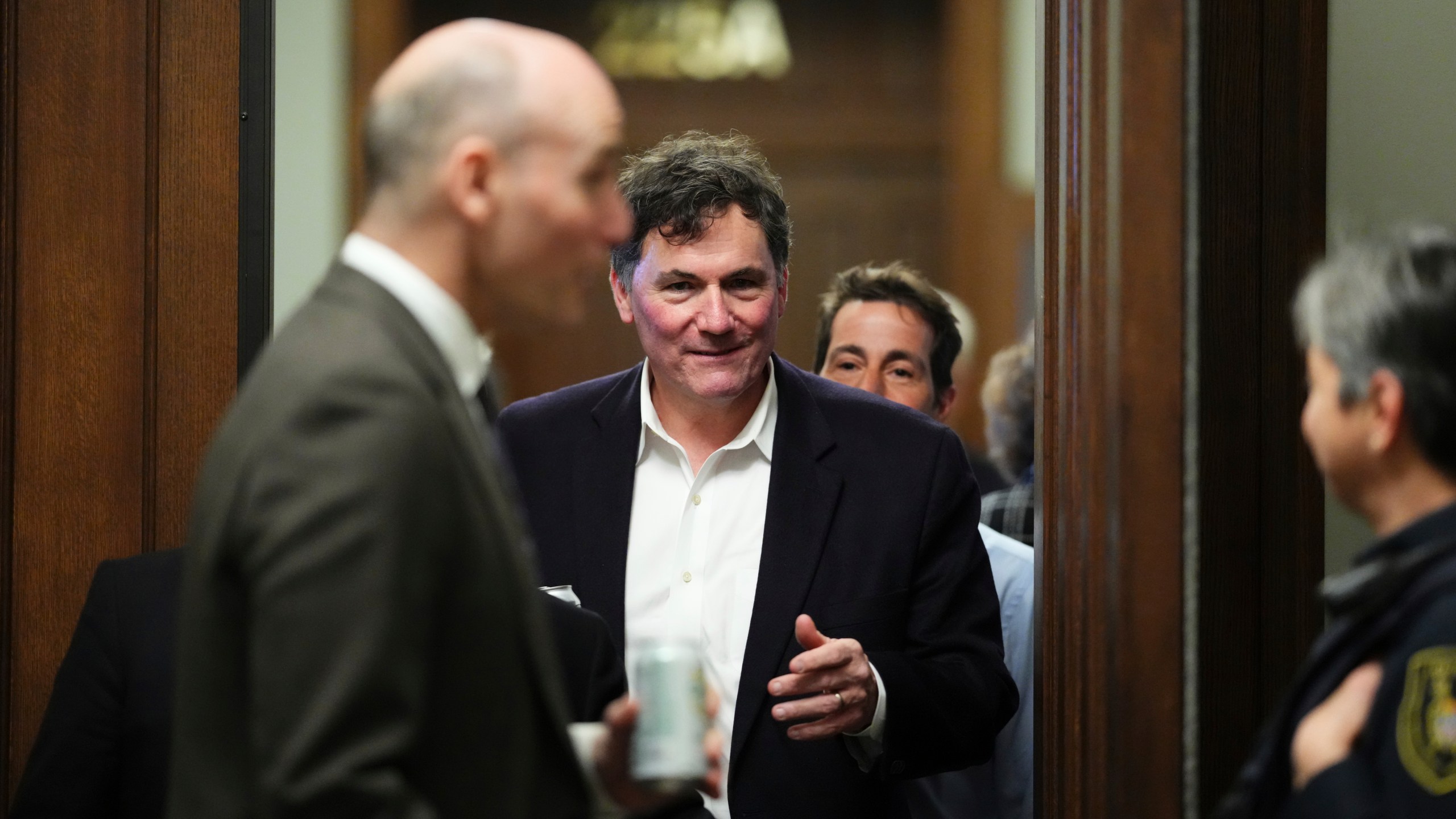 Finance Minister Dominic LeBlanc leaves during a break in a Liberal caucus meeting in Ottawa on Wednesday, Jan. 8, 2025. (Sean Kilpatrick/The Canadian Press via AP)