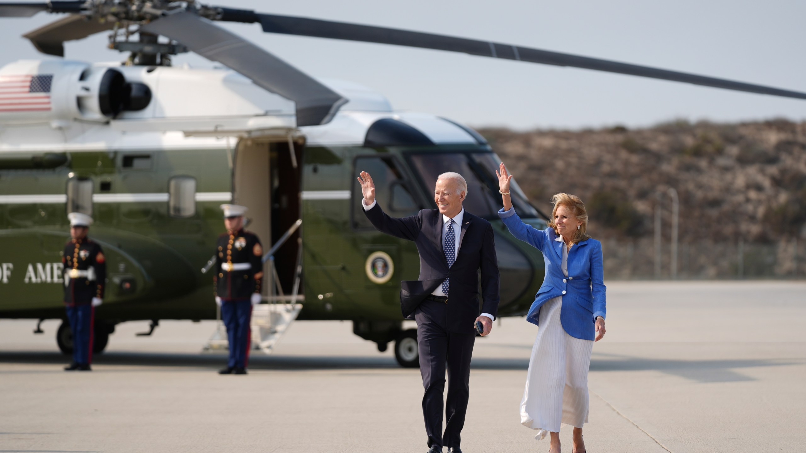 President Joe Biden and first lady Jill Biden, wave as they walk to board Air Force One at Los Angeles International Airport in Los Angeles, Wednesday, Jan. 8, 2025, en route to Washington. (AP Photo/Stephanie Scarbrough)