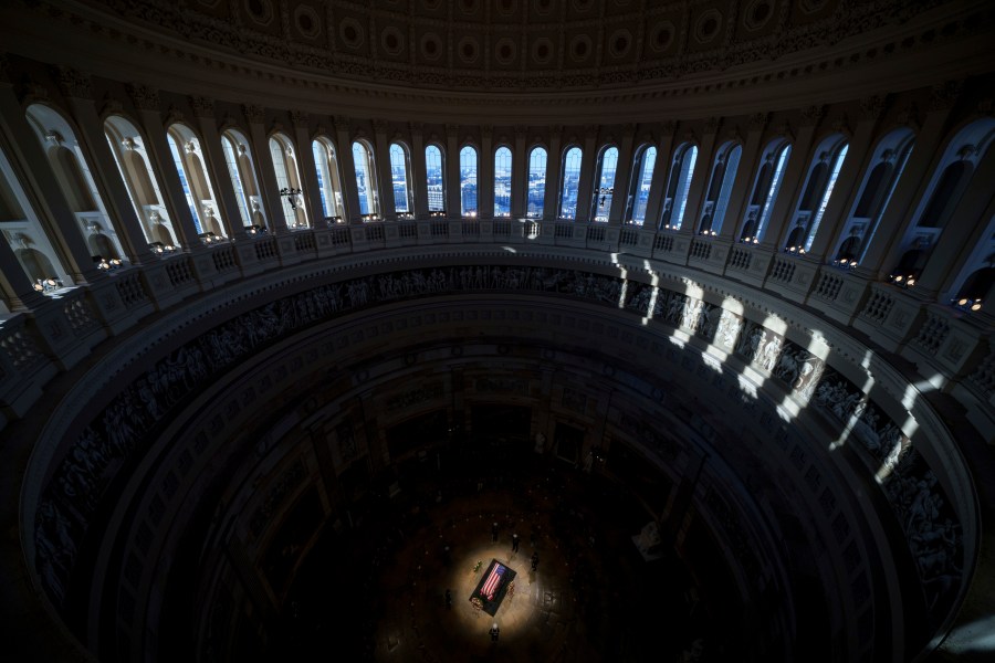 The flag-draped casket of former President Jimmy Carter lies in state at the rotunda of the U.S. Capitol, Wednesday, Jan. 8, 2025, in Washington. (Andrew Harnik/Pool via AP)