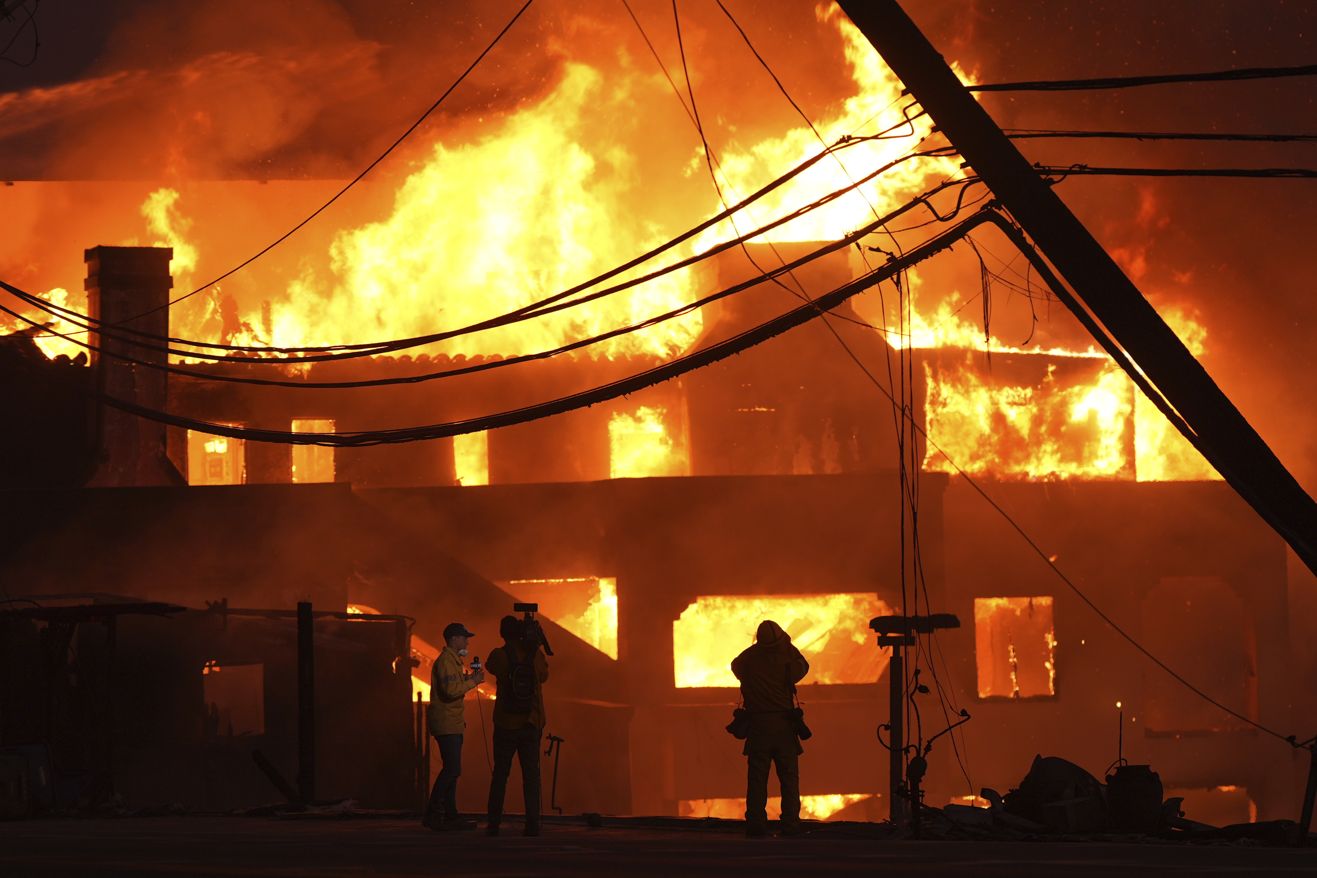 Beach front homes are destroyed by the Palisades Fire Wednesday, Jan. 8, 2025 in Malibu, Calif. (AP Photo/Mark J. Terrill)