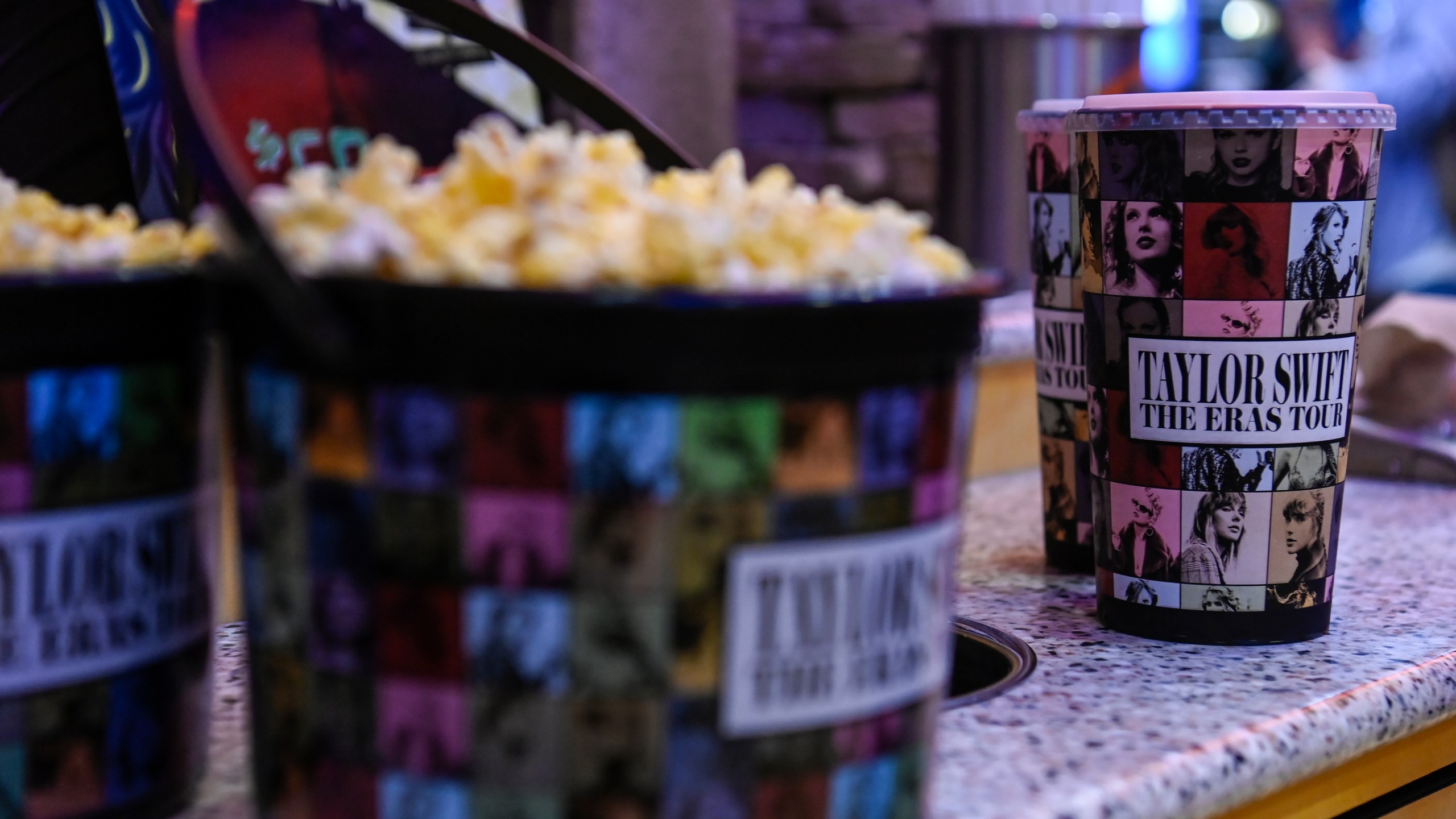 FILE - A collection bucket and cup for "Taylor Swift: The Eras Tour" film is sold at Regal Cinemas, Oct. 13, 2023, in Lynchburg, Va. (Paige Dingler/The News & Advance via AP, File)