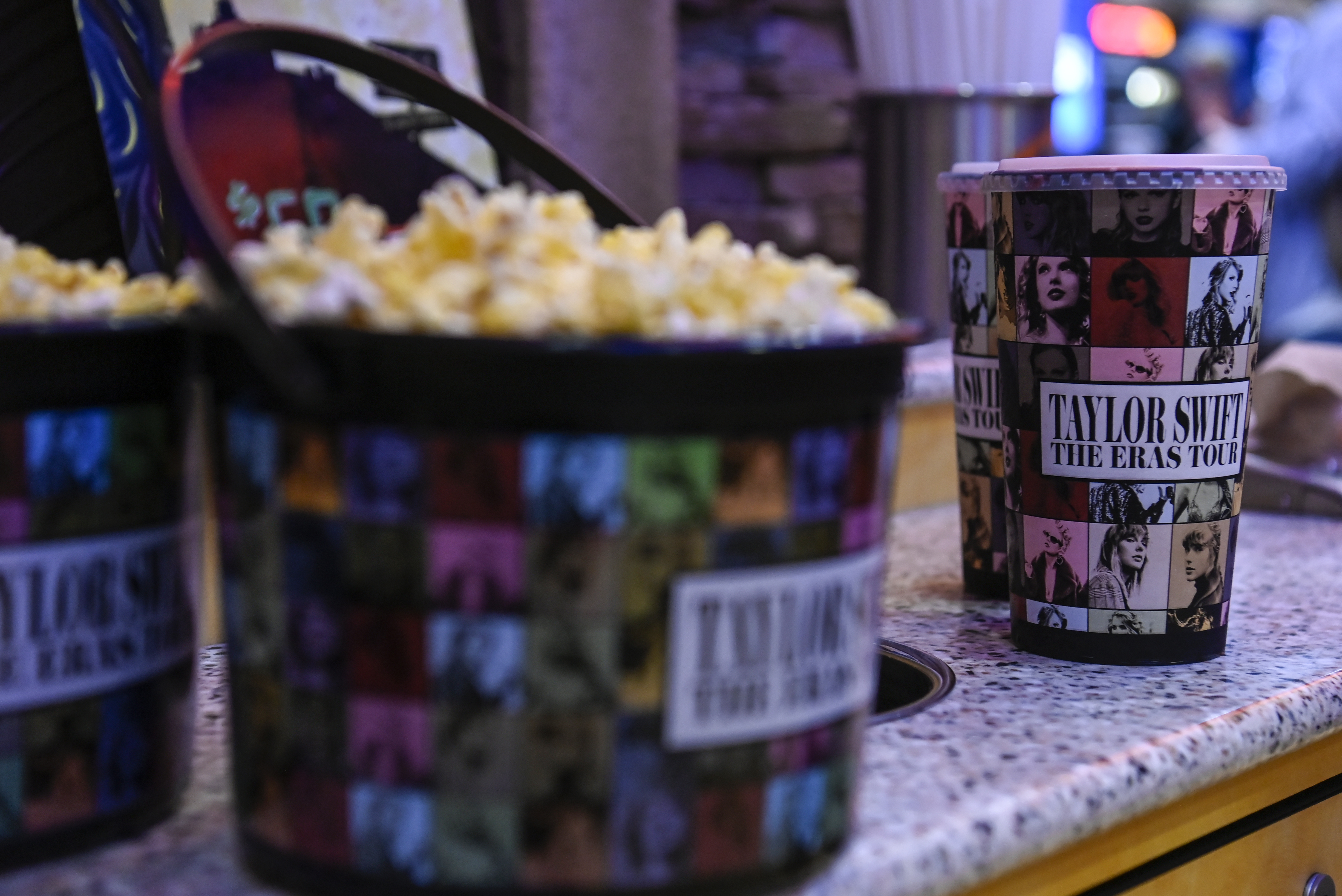 FILE - A collection bucket and cup for "Taylor Swift: The Eras Tour" film is sold at Regal Cinemas, Oct. 13, 2023, in Lynchburg, Va. (Paige Dingler/The News & Advance via AP, File)