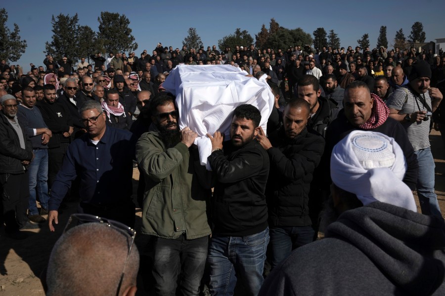 Members of the Bedouin community carry the body of Yosef Al Zaydani, who was in Hamas captivity in the Gaza Strip, a day after the Israeli army said his body was recovered in an underground tunnel in southern Gaza, during his funeral in Rahat, southern Israel, Thursday, Jan. 9, 2025. (AP Photo/Mahmoud Illean)