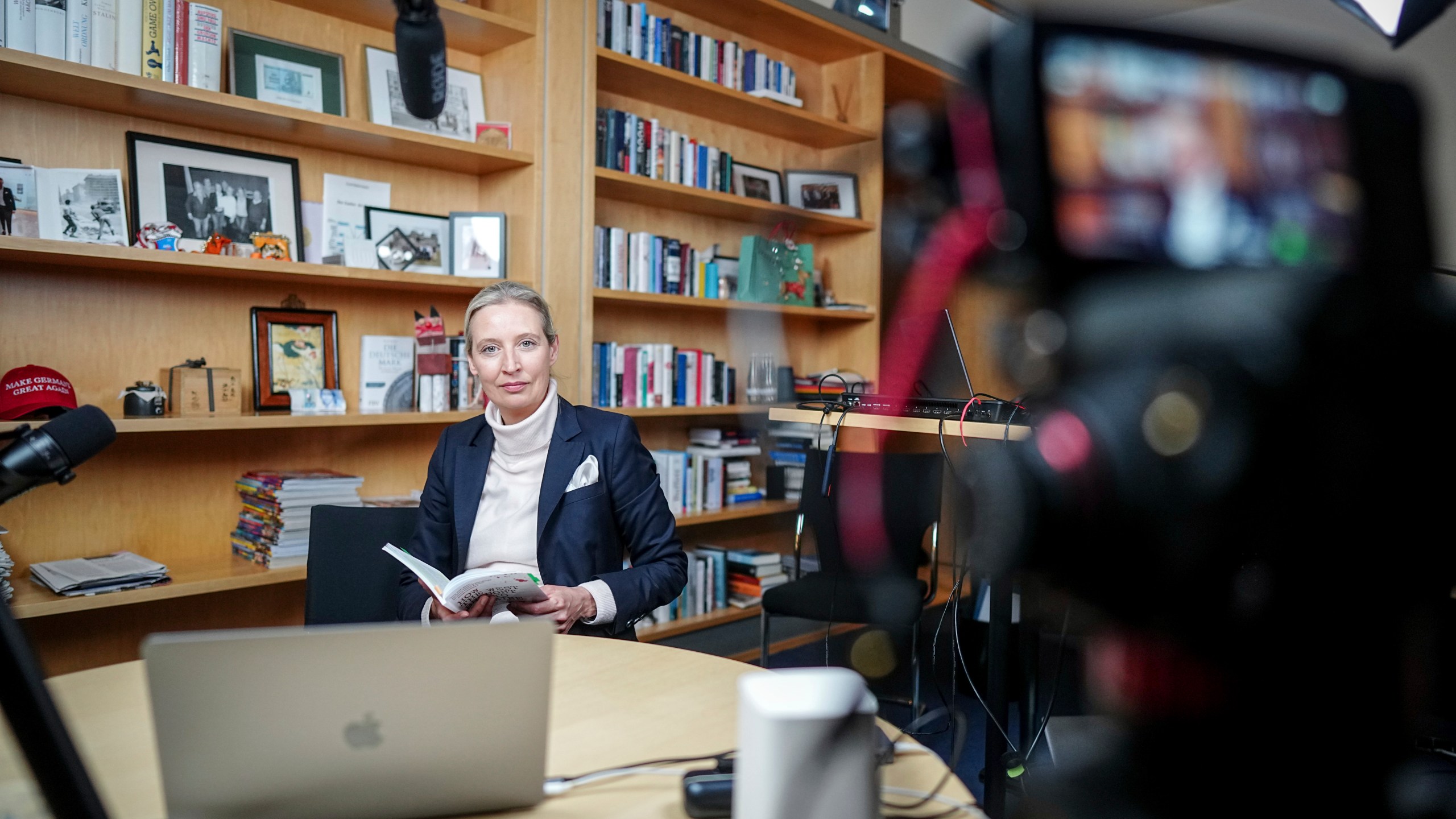 Alice Weidel, parliamentary group leader, party chairwoman and candidate for chancellor of the AfD, prepares for a live X interview with U.S. billionaire Elon Musk in her office in the Jakob Kaiser House in Berlin, on Thursday, Jan. 9, 2025. (Kay Nietfeld/Pool Photo via AP)