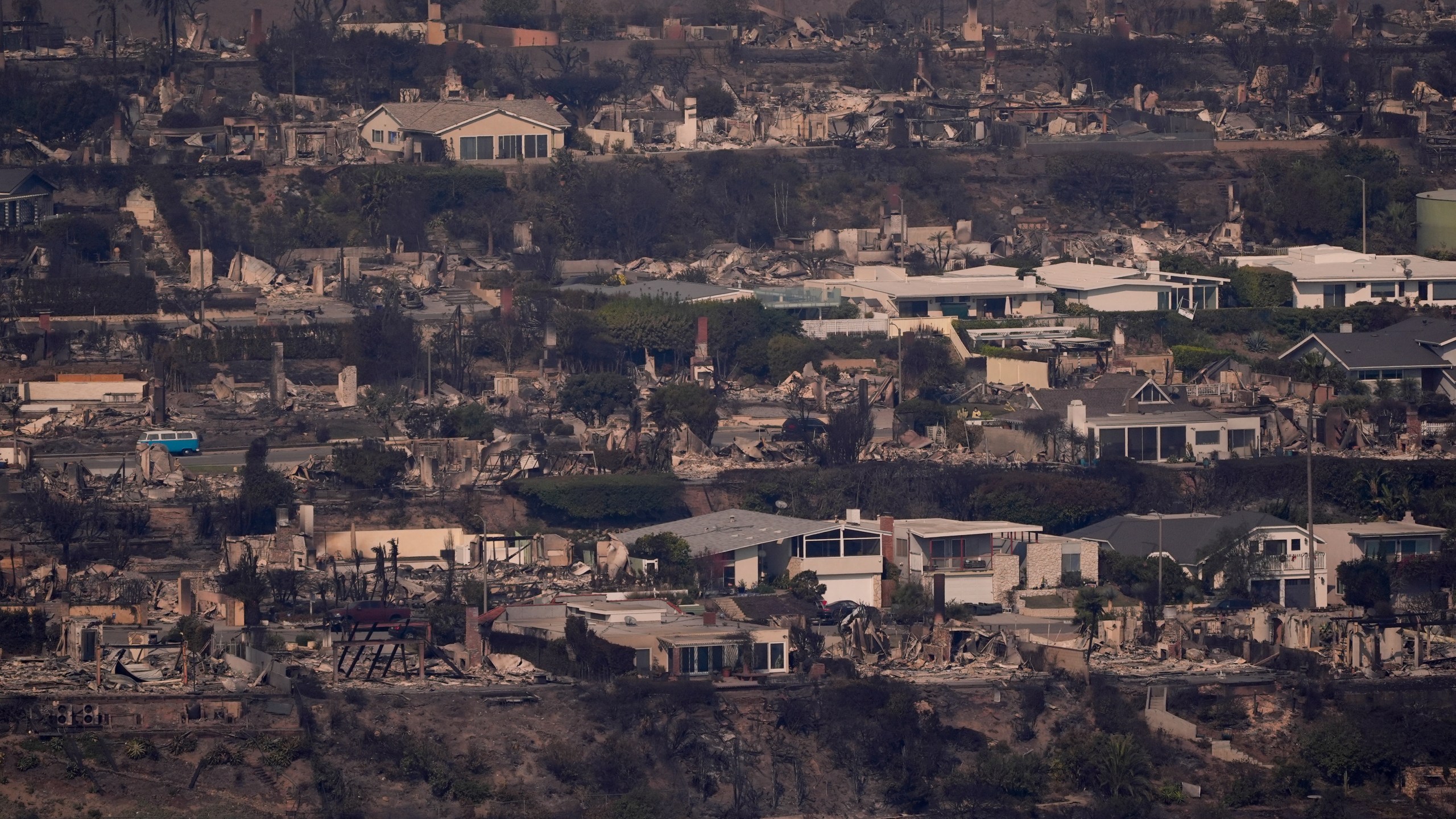 The devastation from the Palisades Fire is seen from the air in the Pacific Palisades neighborhood of Los Angeles, Thursday, Jan. 9, 2025. (AP Photo/Mark J. Terrill)