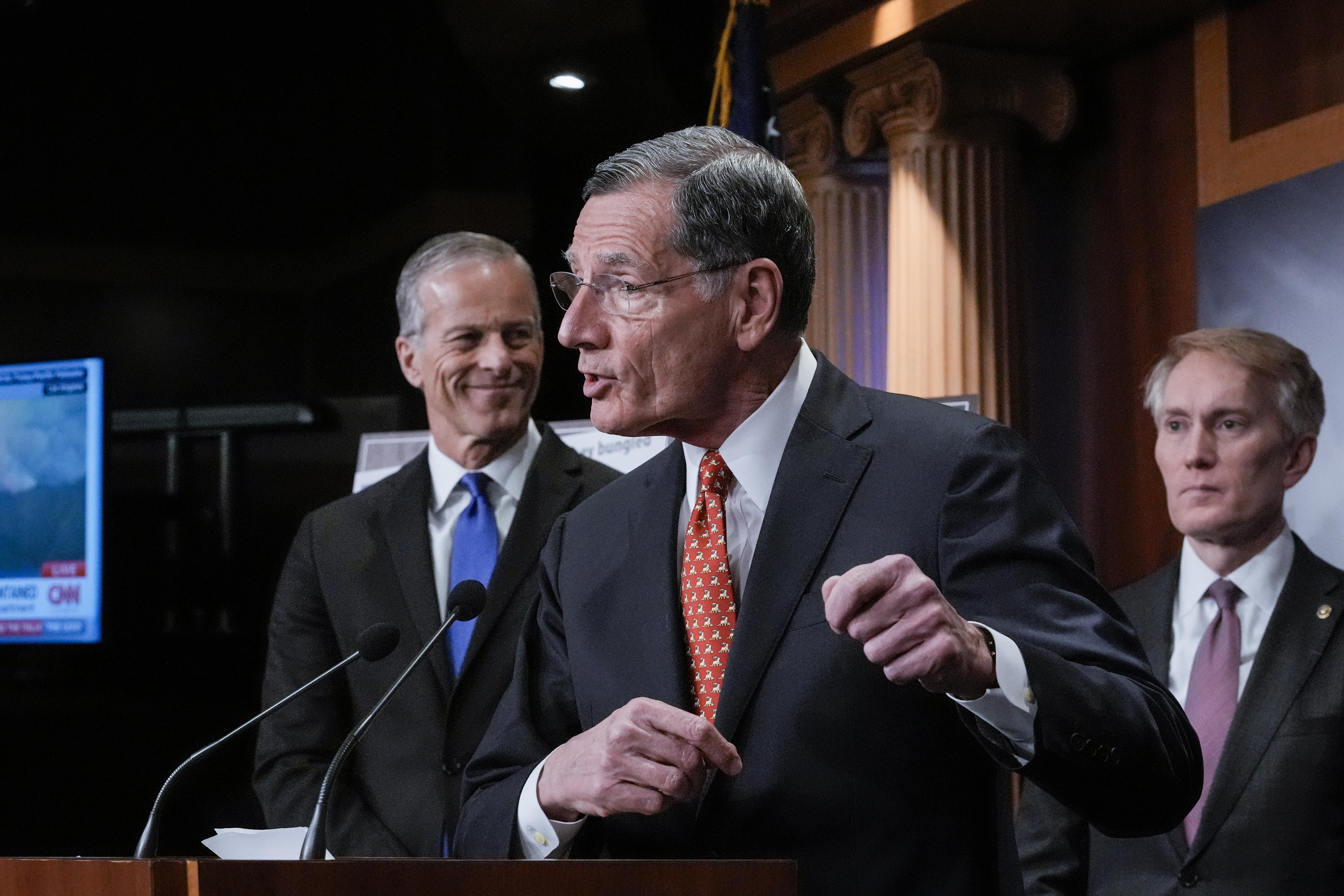 Senate Majority Whip John Barrasso, R-Wyo., center, flanked by Senate Majority Leader John Thune, R-S.D., left, and Sen. James Lankford, R-Okla., speaks to reporters about the Laken Riley Act, a bill to detain unauthorized immigrants who have been accused of certain crimes, at the Capitol in Washington, Thursday, Jan. 9, 2025. Georgia nursing student Laken Riley was killed last year by a Venezuelan man who entered the U.S. illegally and was allowed to stay to pursue his immigration case. (AP Photo/J. Scott Applewhite)