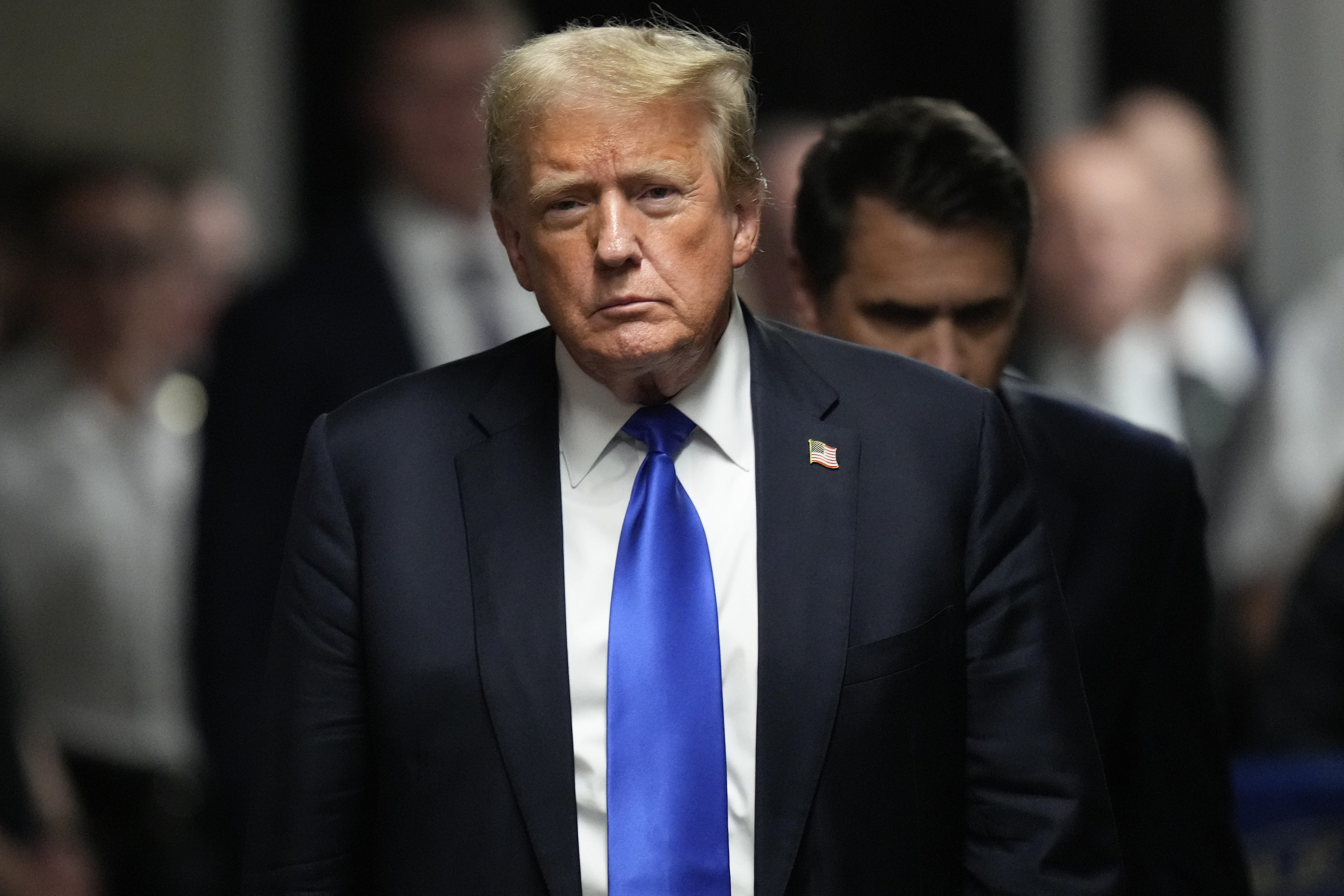 FILE - Former President Donald Trump walks to make comments to members of the media after a jury convicted him of felony crimes for falsifying business records in a scheme to illegally influence the 2016 election, at Manhattan Criminal Court, May 30, 2024, in New York. (AP Photo/Seth Wenig, Pool, File)