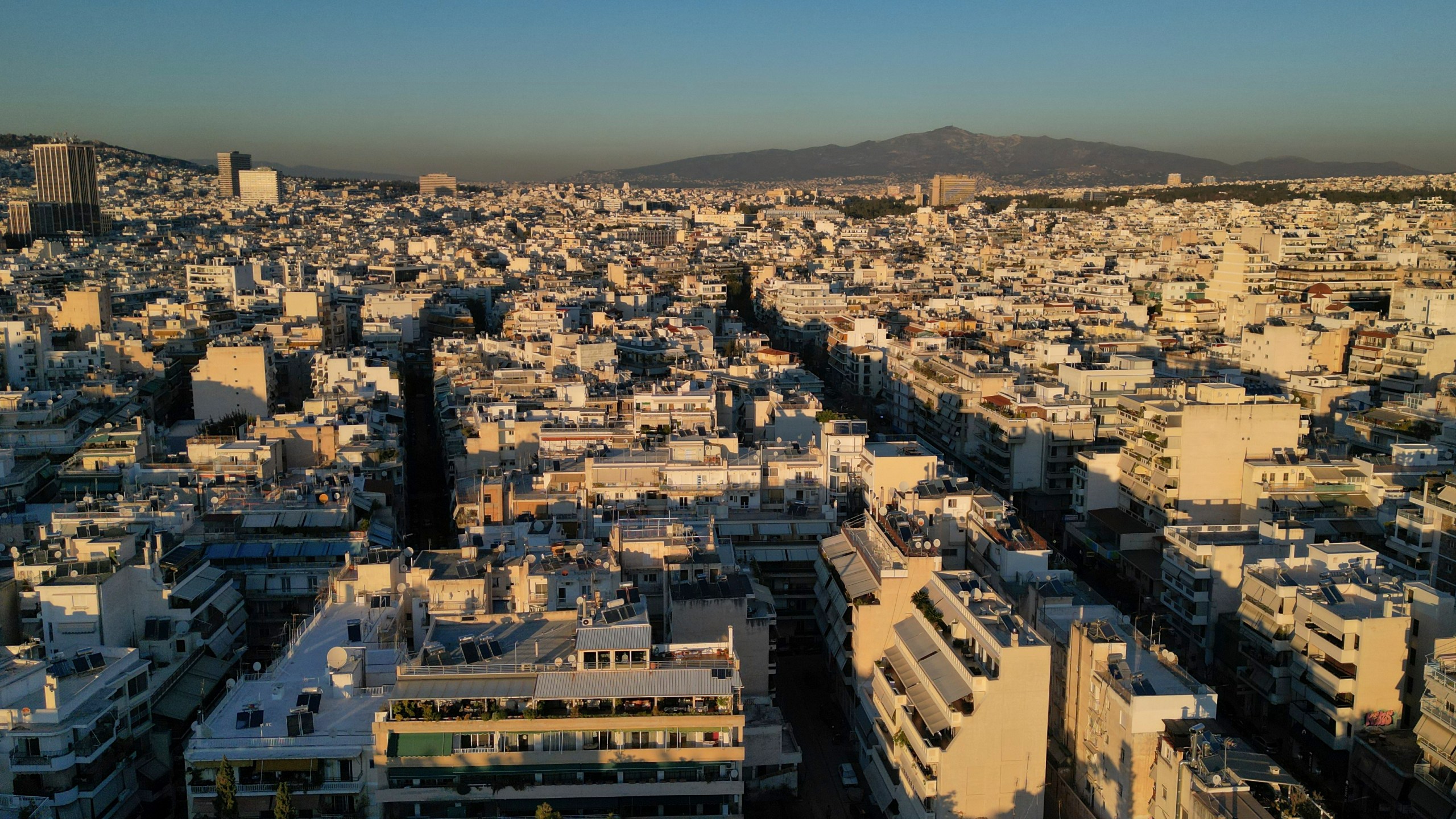 FILE - An aerial photograph taken by a drone shows buildings in Athens, Greece, Tuesday, Dec. 17, 2024. (AP Photo/Thanassis Stavrakis, File)