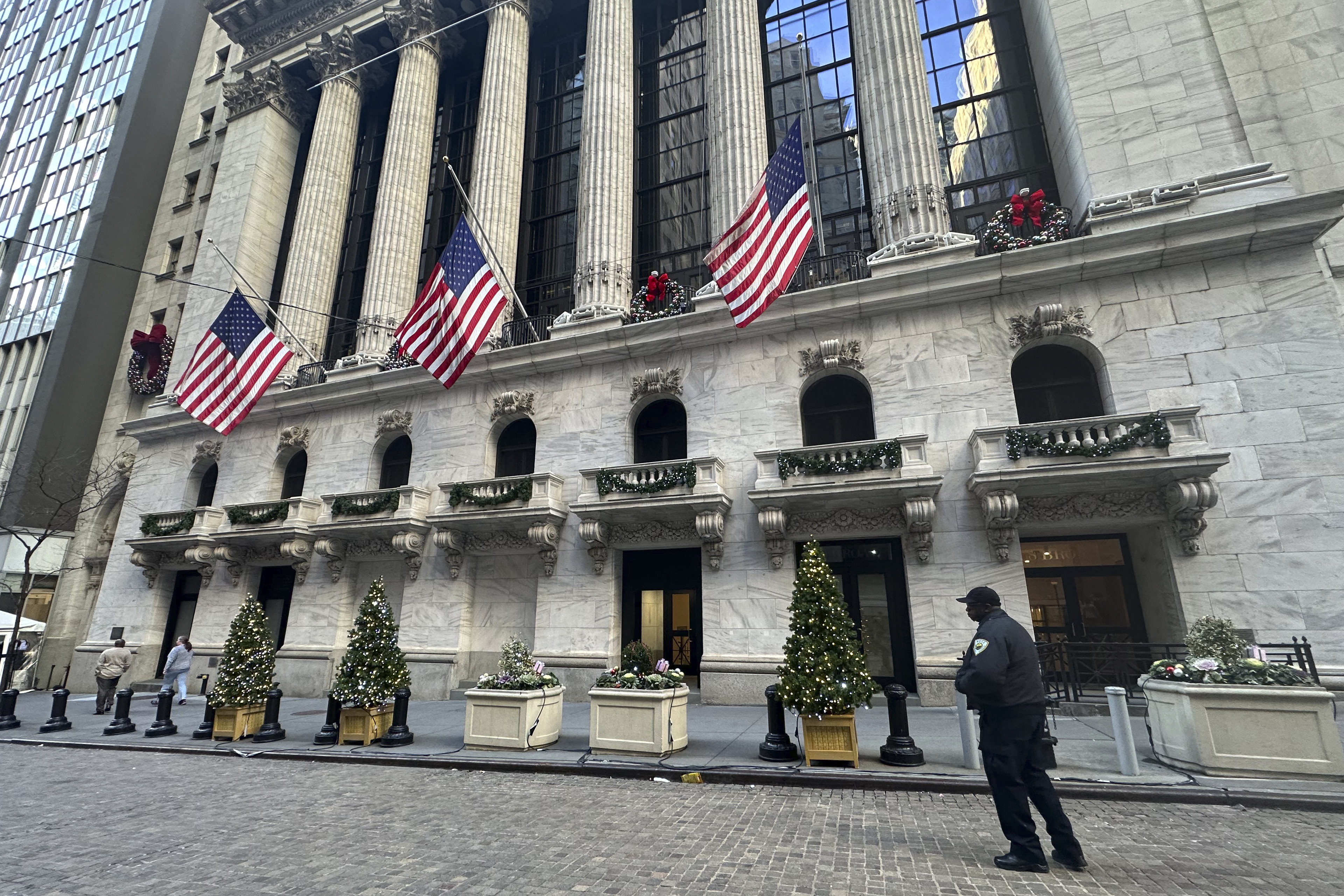 FILE - The New York Stock Exchange is shown in New York's Financial District on Dec. 31, 2024. American flags flew at half-staff there following the death of former U.S. president Jimmy Carter. (AP Photo/Peter Morgan, File)