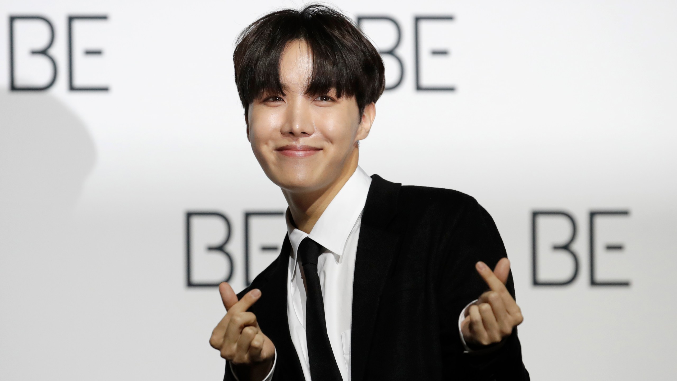 FILE - J-Hope, a member of South Korean K-pop band BTS poses for photographers during a press conference to introduce their new album "BE" in Seoul, South Korea, Nov. 20, 2020. (AP Photo/Lee Jin-man, File)