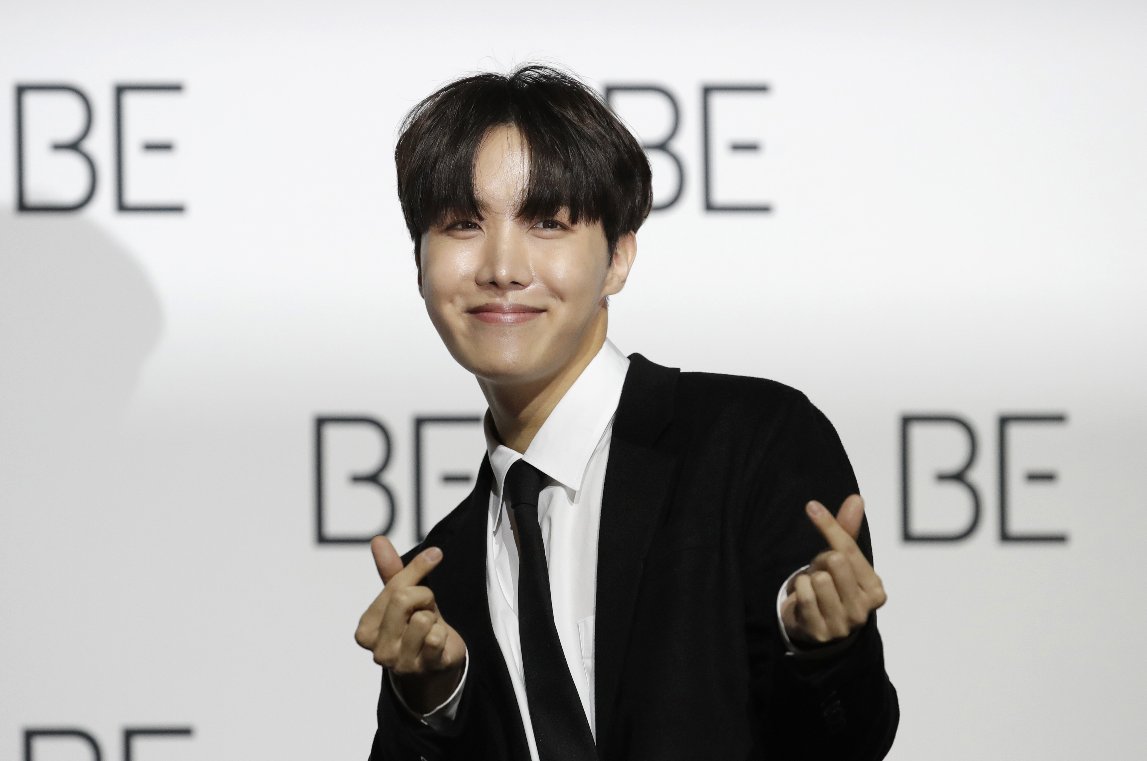 FILE - J-Hope, a member of South Korean K-pop band BTS poses for photographers during a press conference to introduce their new album "BE" in Seoul, South Korea, Nov. 20, 2020. (AP Photo/Lee Jin-man, File)