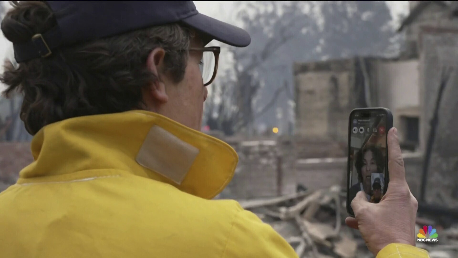 This image provided by NBC shows reporter Jacob Soboroff on a FaceTime call with his mother from in front of the burnt-out home where grew up in Pacific Palisades, Calif., Wednesday, Jan. 8, 2025. (NBC via AP)