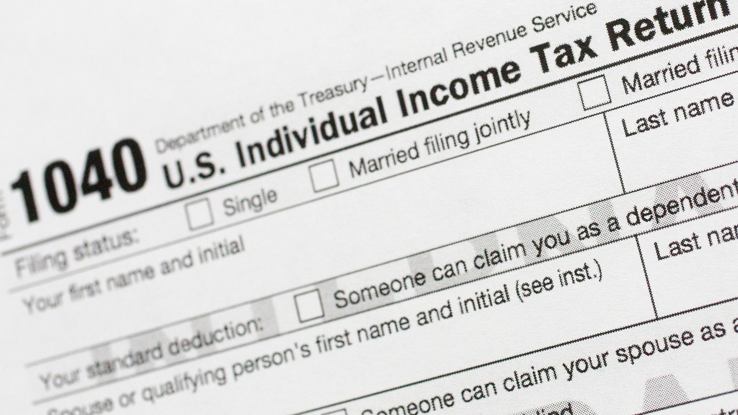 FILE - Part of a 1040 U.S. Individual Income Tax Return form is shown July 24, 2018, in New York. (AP Photo/Mark Lennihan, File)