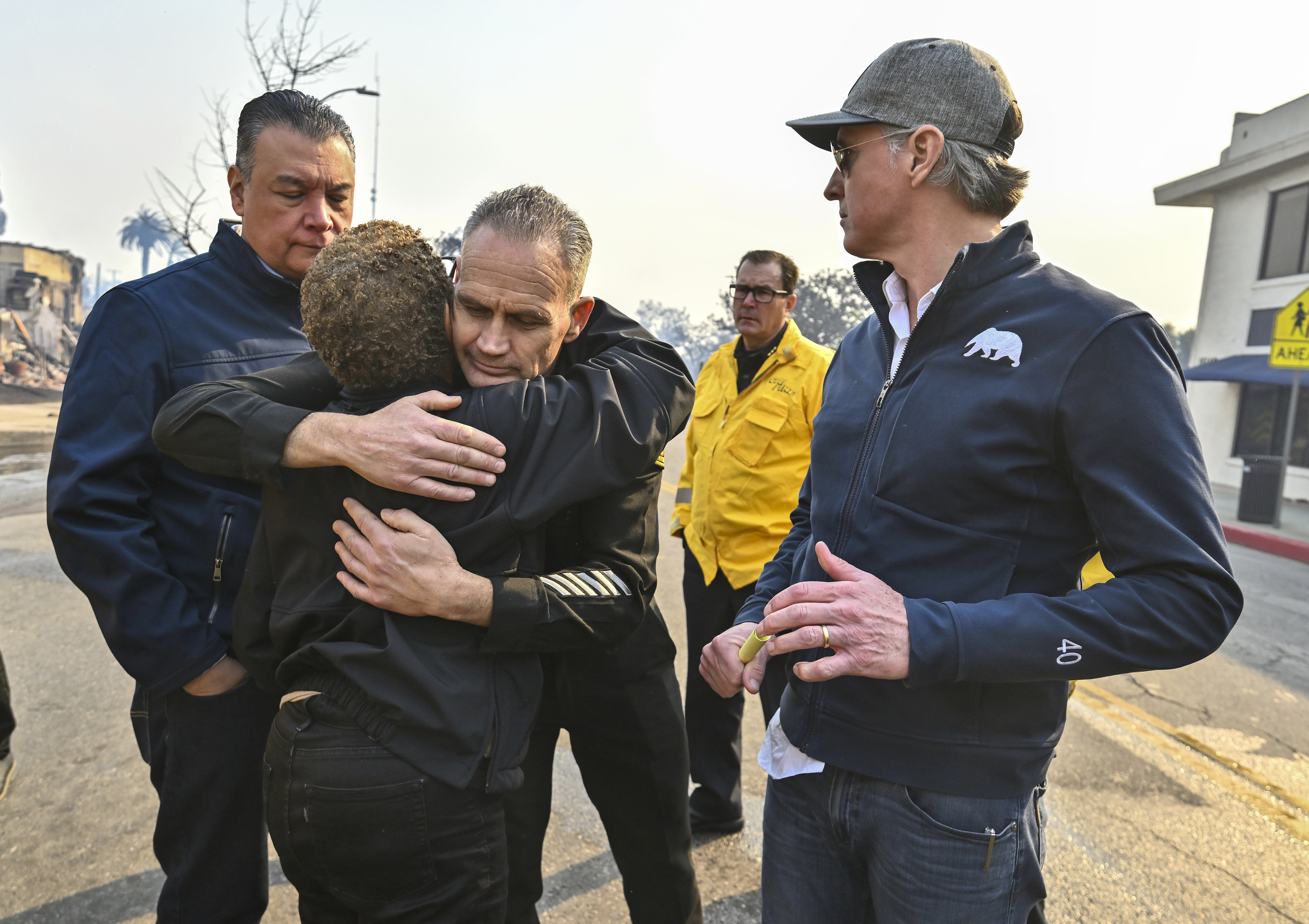 Los Angeles City Fire Captain Frank Lima, greets Los Angeles Mayor Karen Bass, as she joins California Governor Gavin Newsom, right, and Senator Alex Padilla, D-Calif., while surveying damage during the Palisades Fire Wednesday, Jan. 8, 2025, in Pacific Palisades, Calif. (Jeff Gritchen/The Orange County Register via AP)