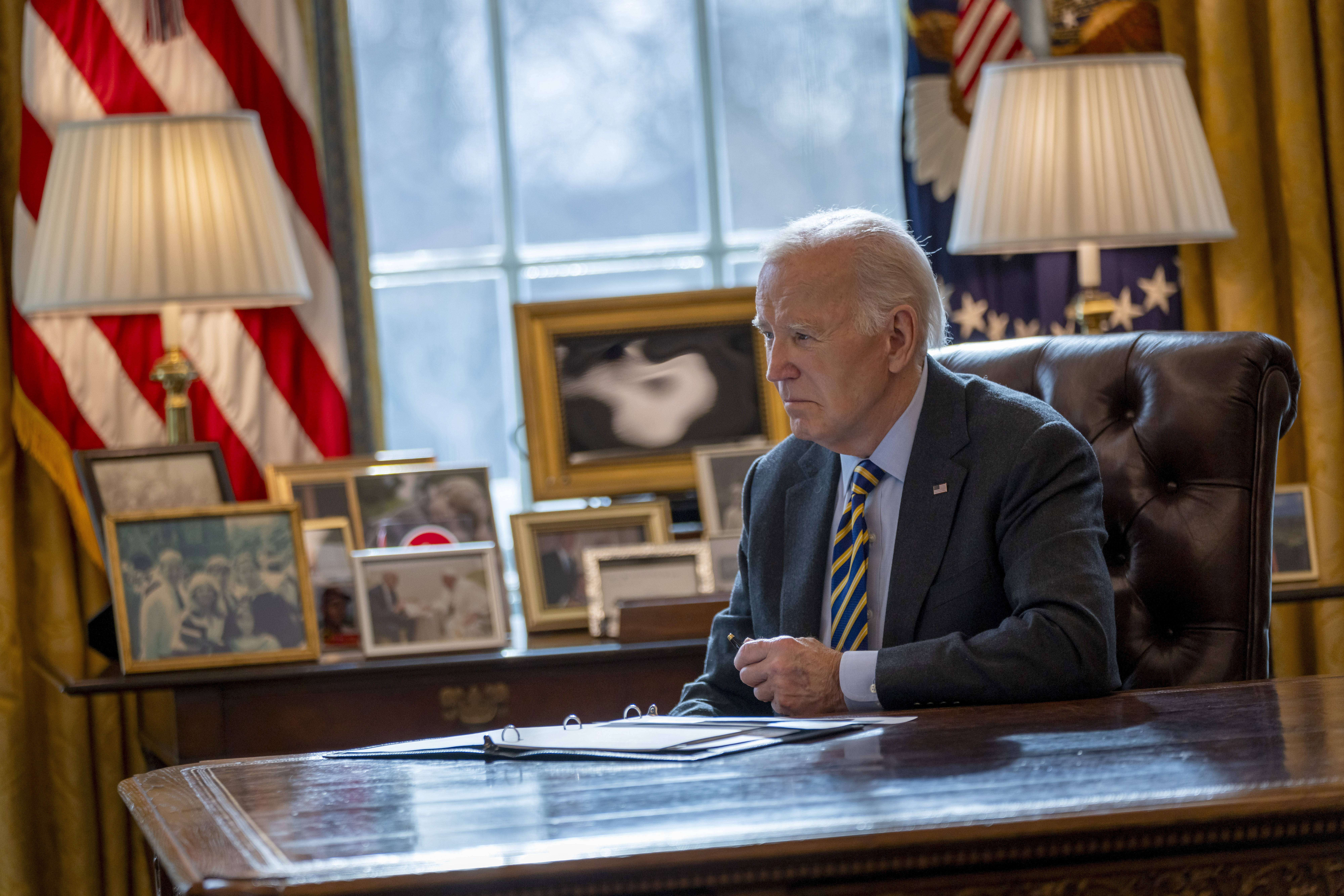 President Joe Biden listens during a briefing regarding the federal response to the spread of wildfires in the Los Angeles area, Friday, Jan. 10, 2025, in the Oval Office at the White House in Washington. (AP Photo/Ben Curtis)