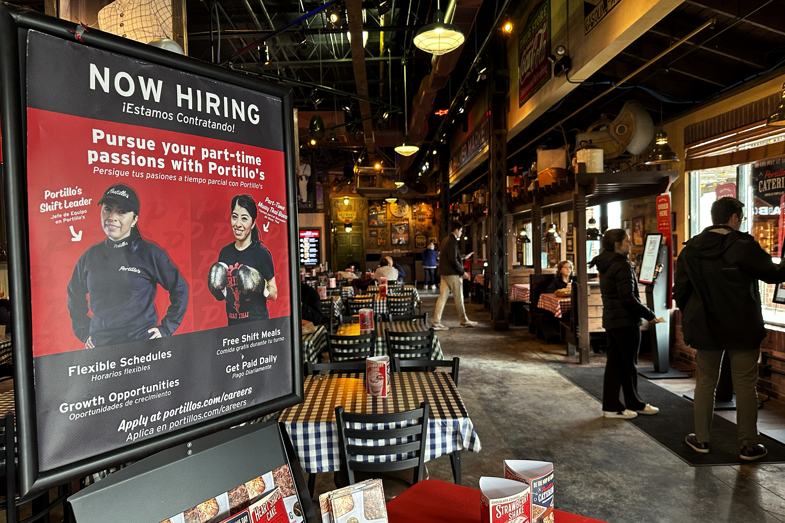 A hiring sign is displayed at a restaurant in Skokie, Ill., Wednesday, Jan. 8, 2025. (AP Photo/Nam Y. Huh)