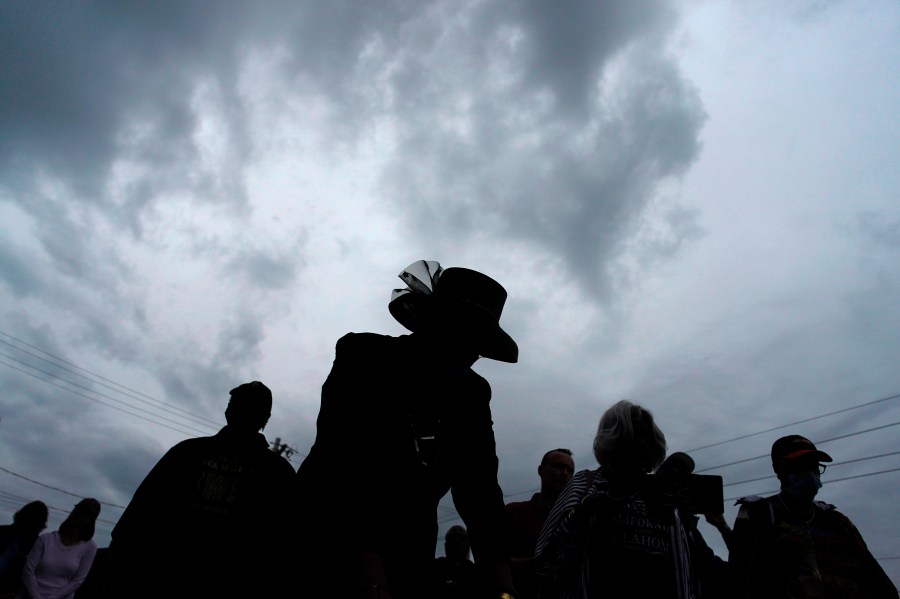 FILE - People attend a dedication of a prayer wall outside of the historic Vernon African Methodist Episcopal Church in the Greenwood neighborhood during the centennial of the Tulsa Race Massacre, in Tulsa, Okla., May 31, 2021. (AP Photo/John Locher, File)