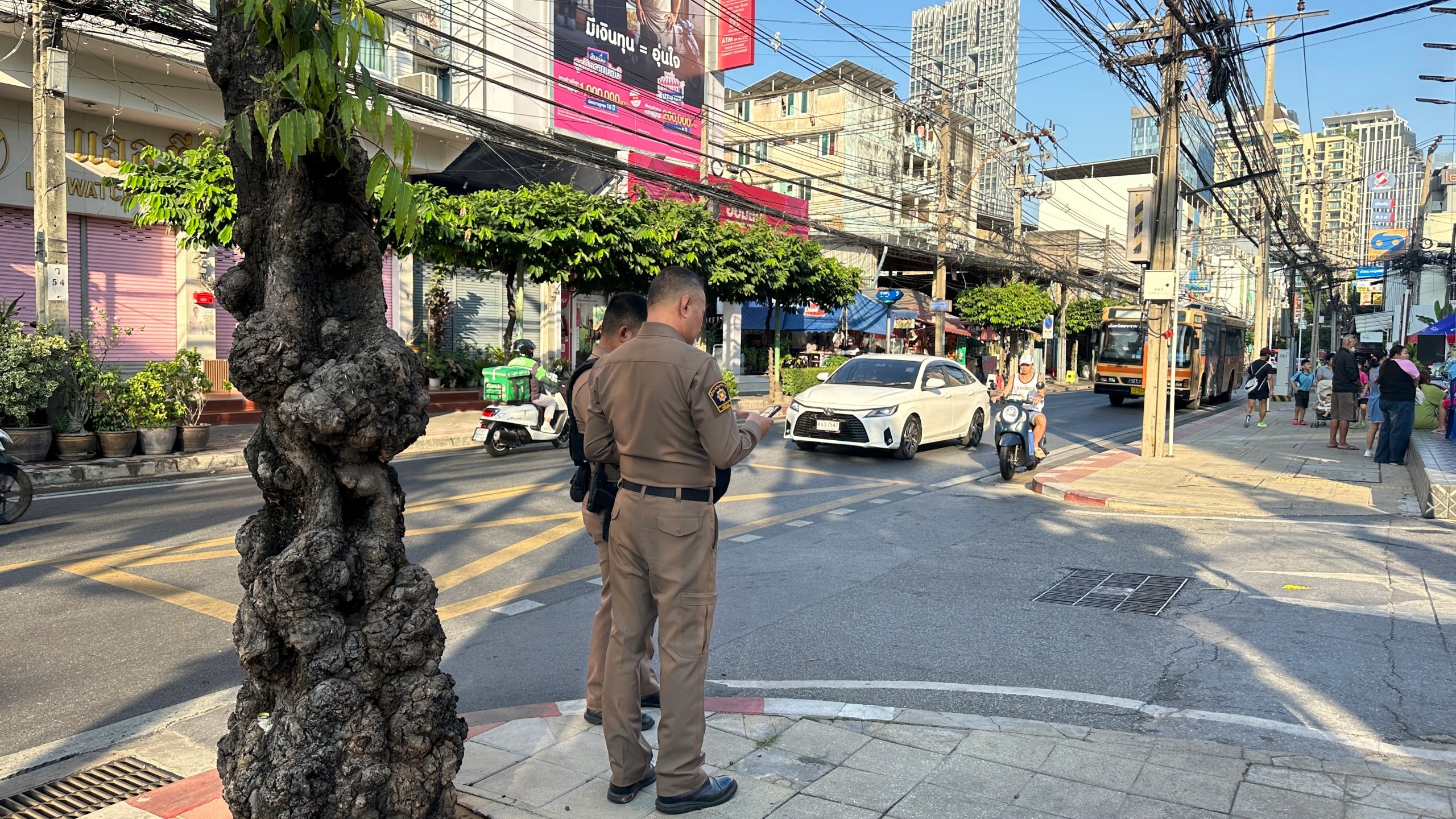 Police stand outside an immigration detention center of the Immigration Bureau where Uyghur detainees are held in Bangkok, Thailand, Saturday, Jan. 11, 2025. The detainees say they are facing deportation back to China, where they fear persecution. (AP Photo/Haruka Nuga)