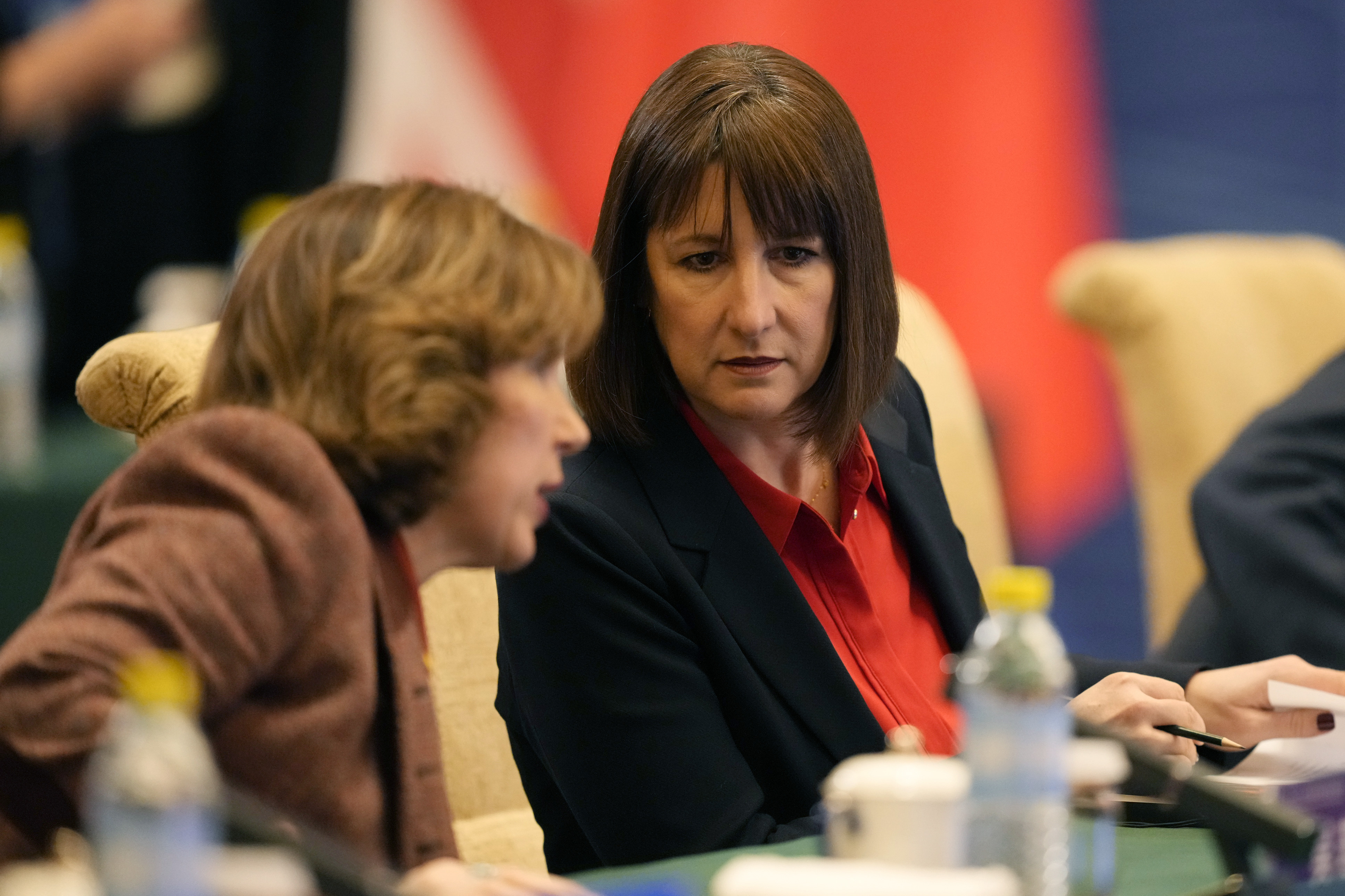 Britain's Chancellor of the Exchequer Rachel Reeves, right listens, during the 11th China - UK Economy and Finance Dialogue in Beijing, Saturday, Jan. 11, 2025. (AP Photo/Aaron Favila, Pool)