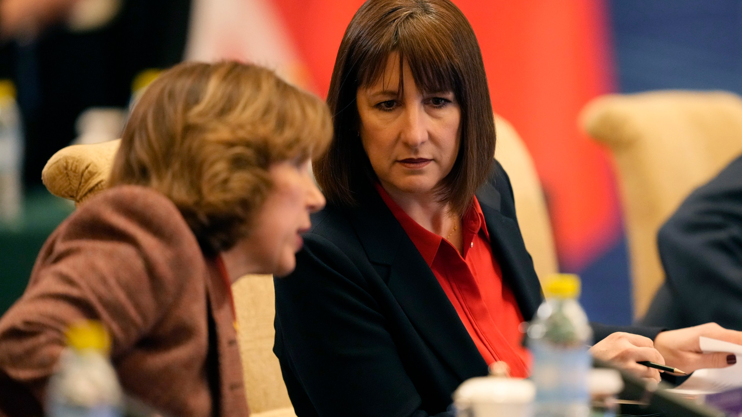 Britain's Chancellor of the Exchequer Rachel Reeves, right listens, during the 11th China - UK Economy and Finance Dialogue in Beijing, Saturday, Jan. 11, 2025. (AP Photo/Aaron Favila, Pool)