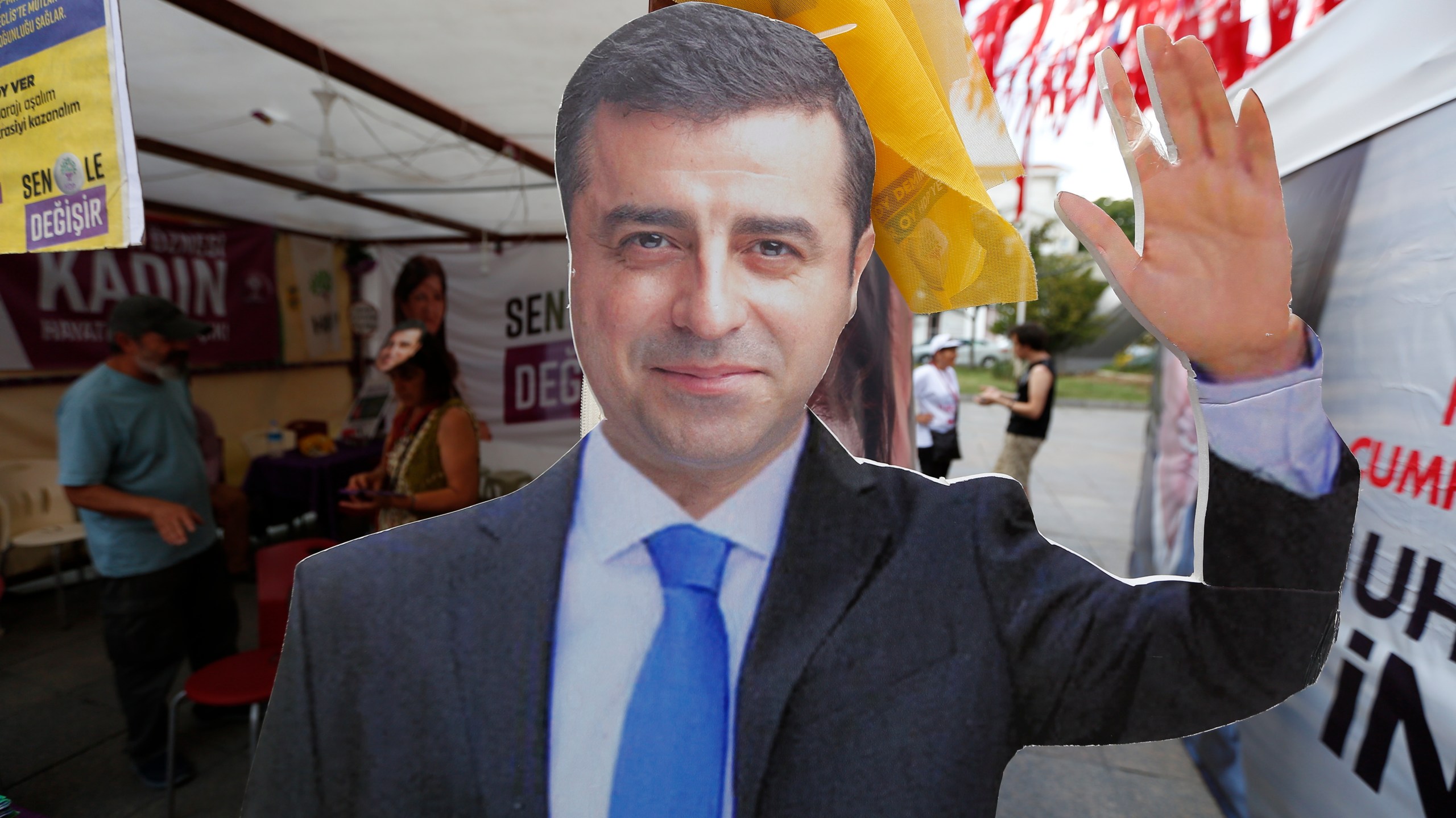 FILE - A cardboard cut-out of Selahattin Demirtas is pictured at an election kiosk in Istanbul, June 20, 2018. (AP Photo/Lefteris Pitarakis, File)