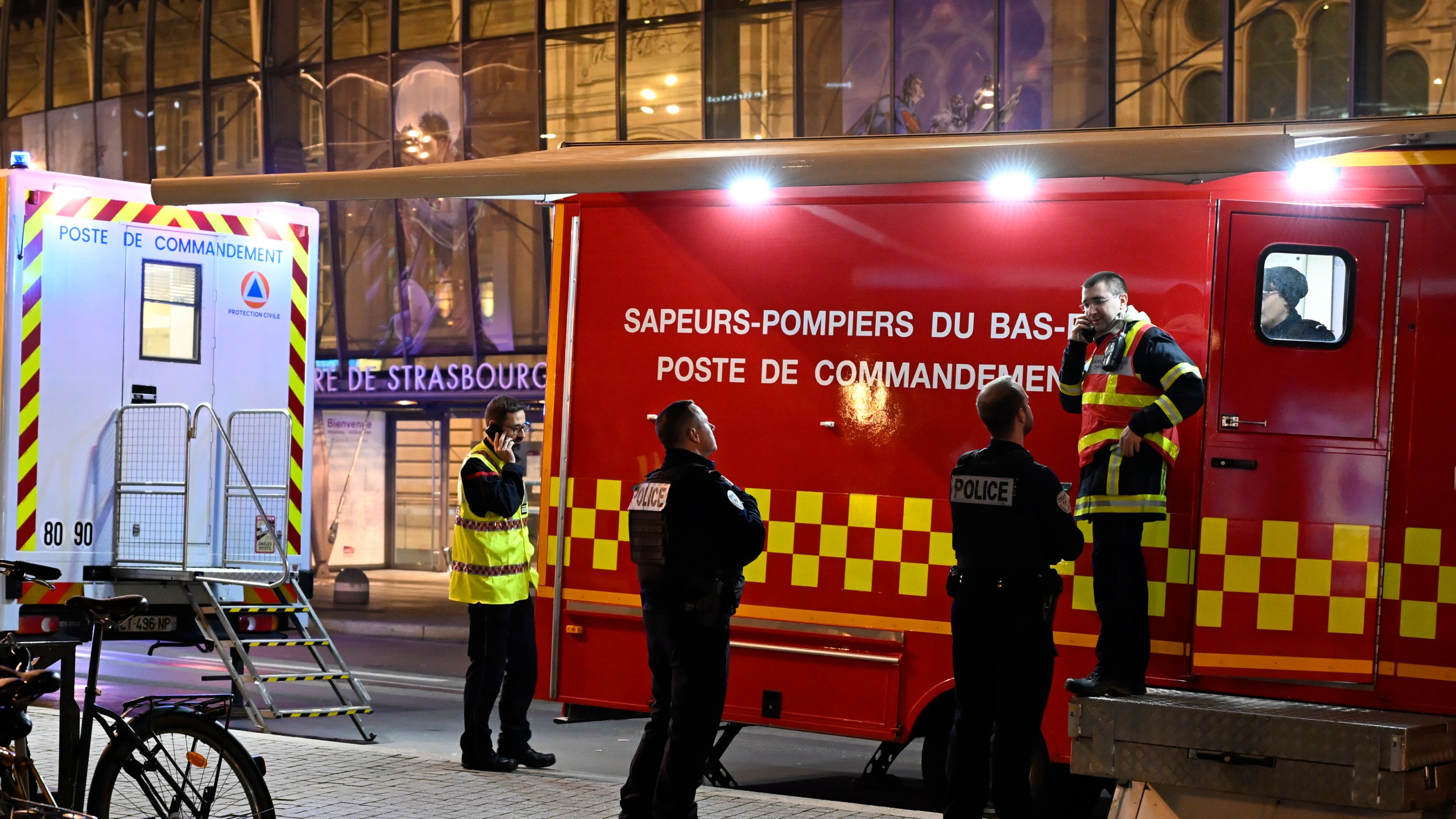 Police officers and rescue workers gather at the train station after two trams collided, injuring dozens of people, though none critically, firefighters said, Saturday, Jan. 11, 2025 in Strasbourg, eastern France. (AP Photo/Pascal Bastien)