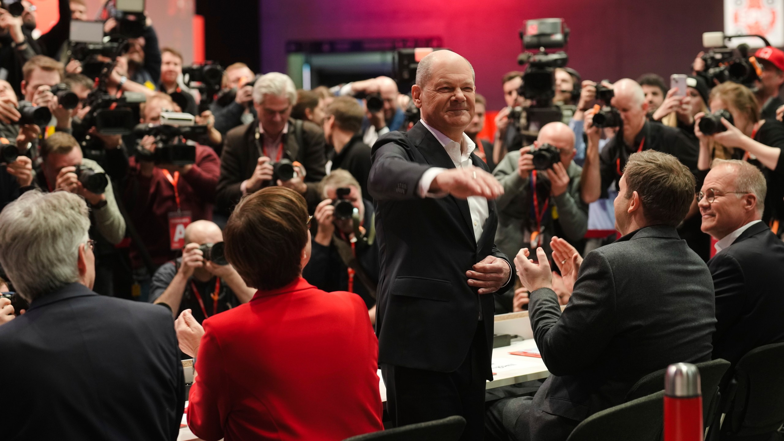 German Chancellor Olaf Scholz, center, waves as he arrives at a special party convention of the Social Democratic Party, SPD, in Berlin, Germany, Saturday, Jan. 11, 2025. (AP Photo/Markus Schreiber)