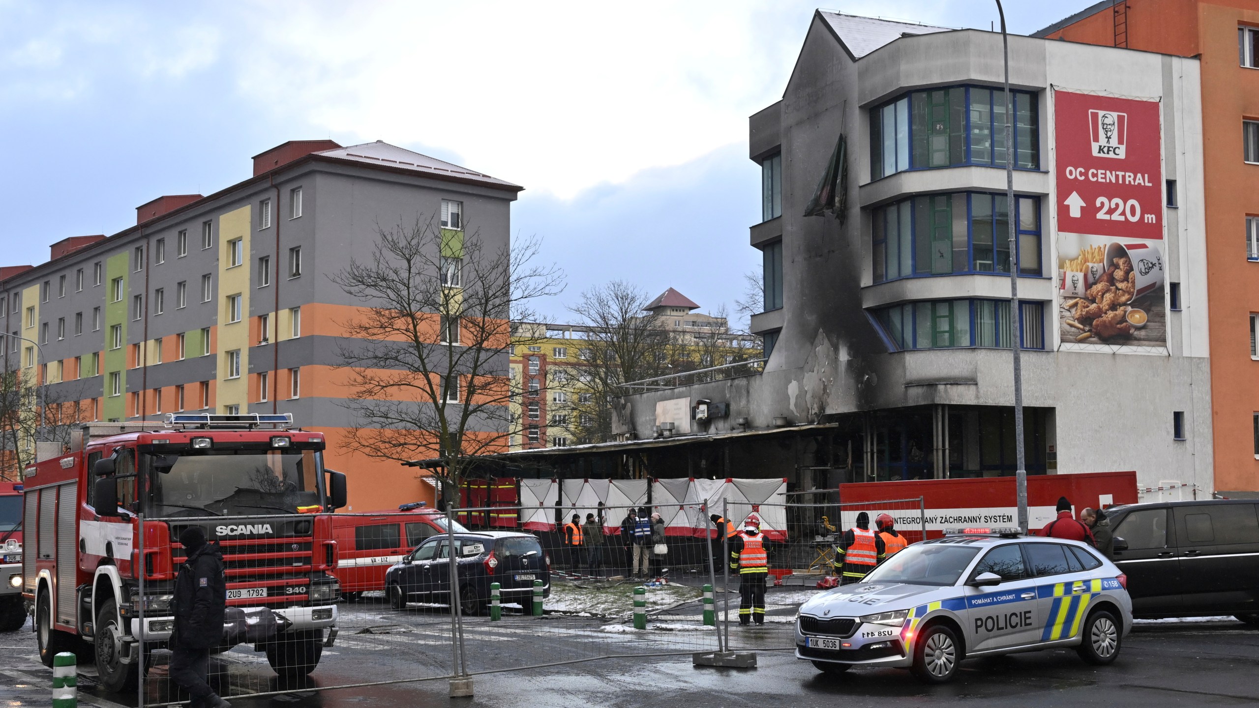 Emergency services attend the scene of a fire at a restaurant in Most, Czech Republic, Sunday Jan. 12, 2025. (Ondrej Hajek/CTK via AP)