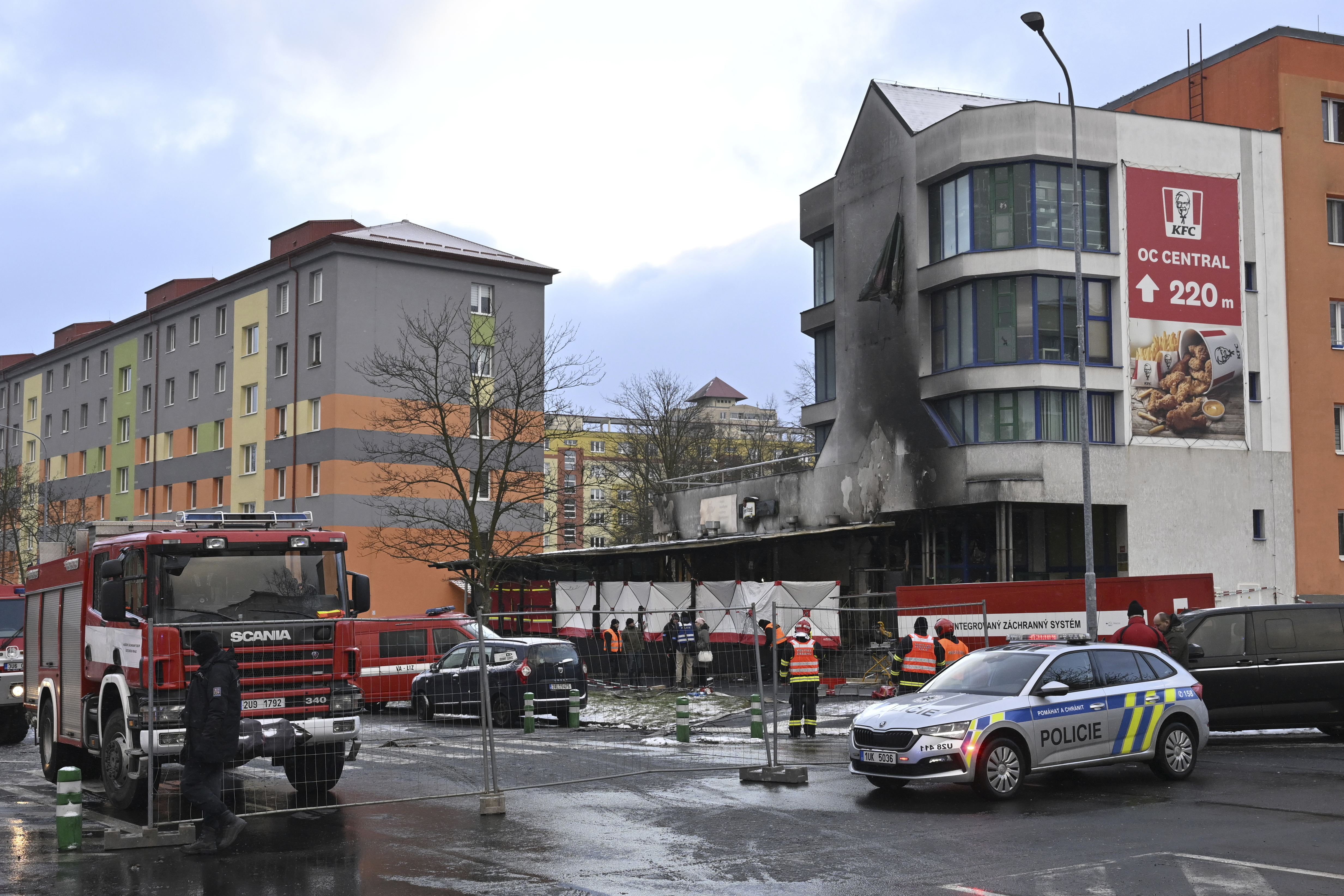 Emergency services attend the scene of a fire at a restaurant in Most, Czech Republic, Sunday Jan. 12, 2025. (Ondrej Hajek/CTK via AP)