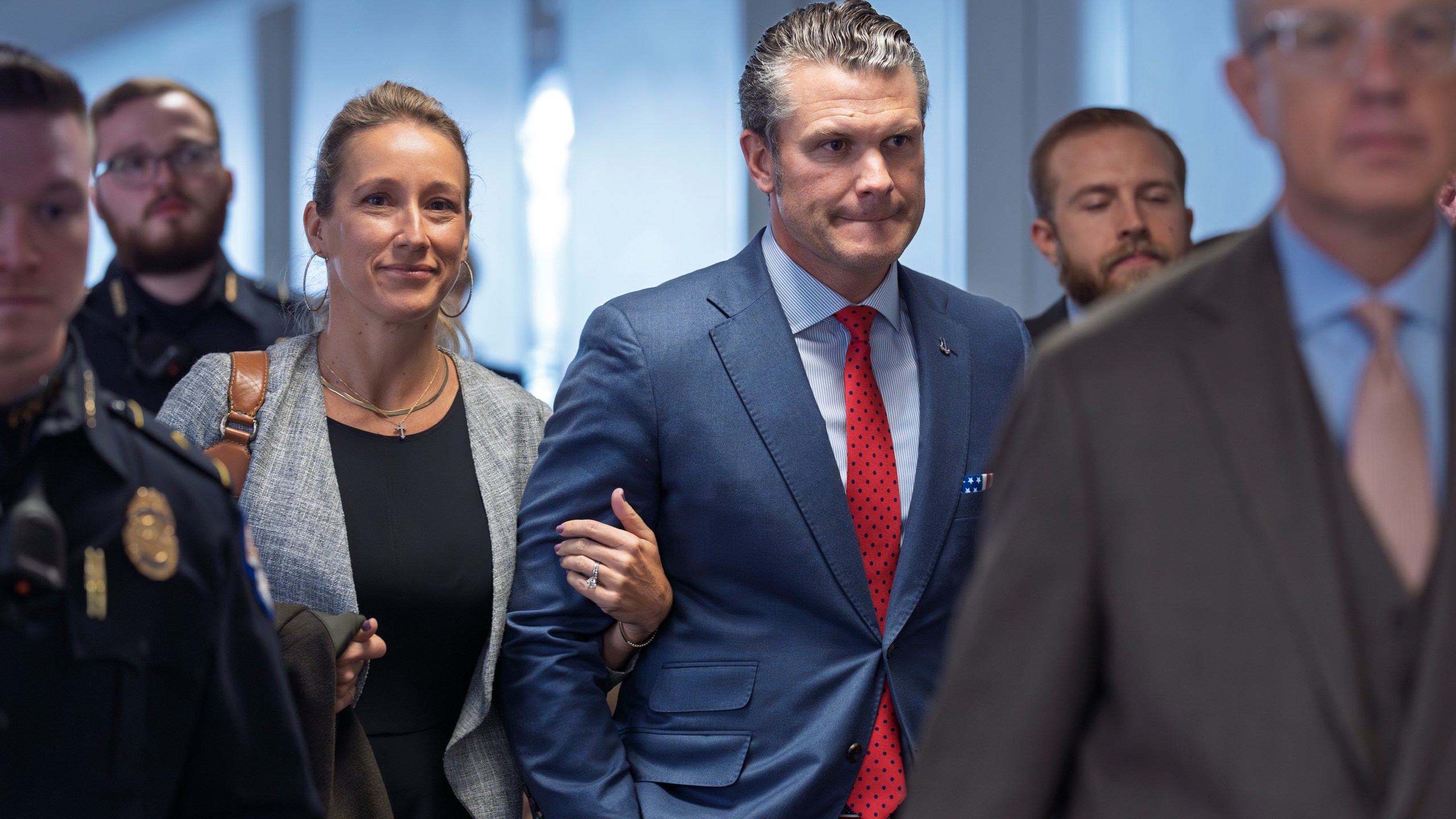 FILE - Pete Hegseth, President-elect Donald Trump's nominee to be defense secretary, right, joined by his wife Jennifer Rauchet, arrives at the Capitol in Washington, Dec. 5, 2024. (AP Photo/J. Scott Applewhite, File)