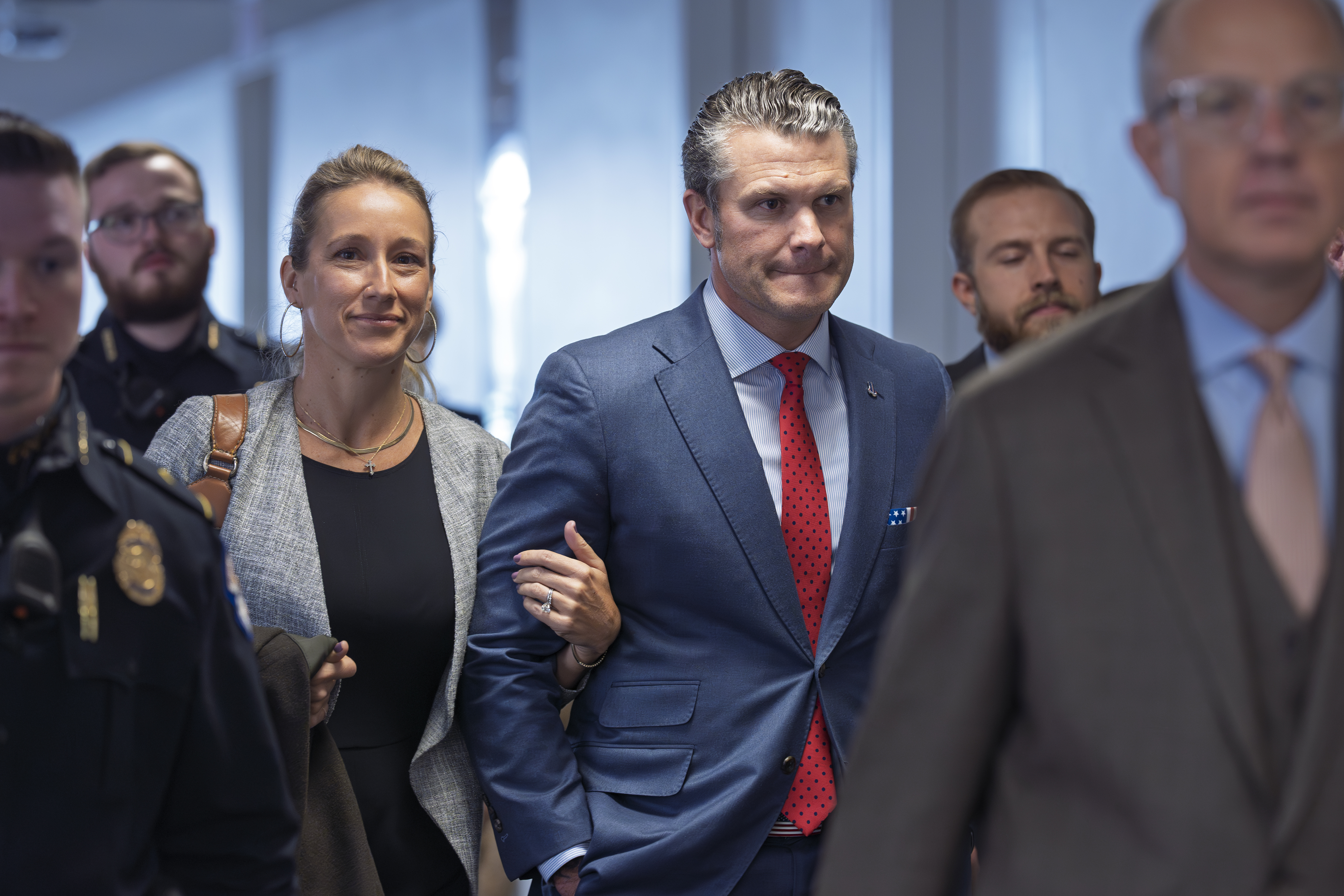 FILE - Pete Hegseth, President-elect Donald Trump's nominee to be defense secretary, right, joined by his wife Jennifer Rauchet, arrives at the Capitol in Washington, Dec. 5, 2024. (AP Photo/J. Scott Applewhite, File)