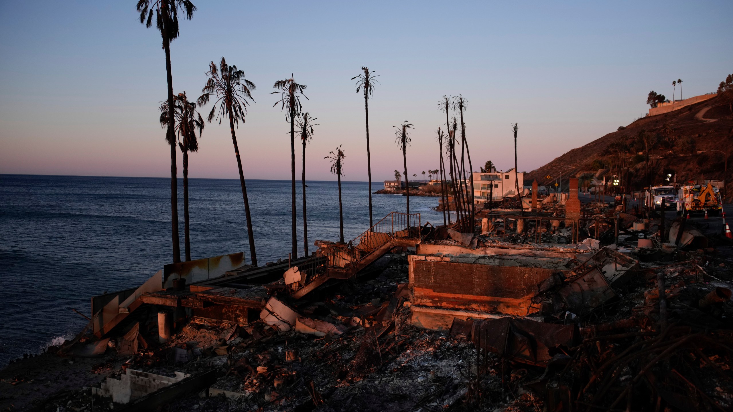 Homes along the Pacific coast are burned to the ground in the aftermath of the Palisades Fire Monday, Jan. 13, 2025 in Malibu, Calif. (AP Photo/John Locher)