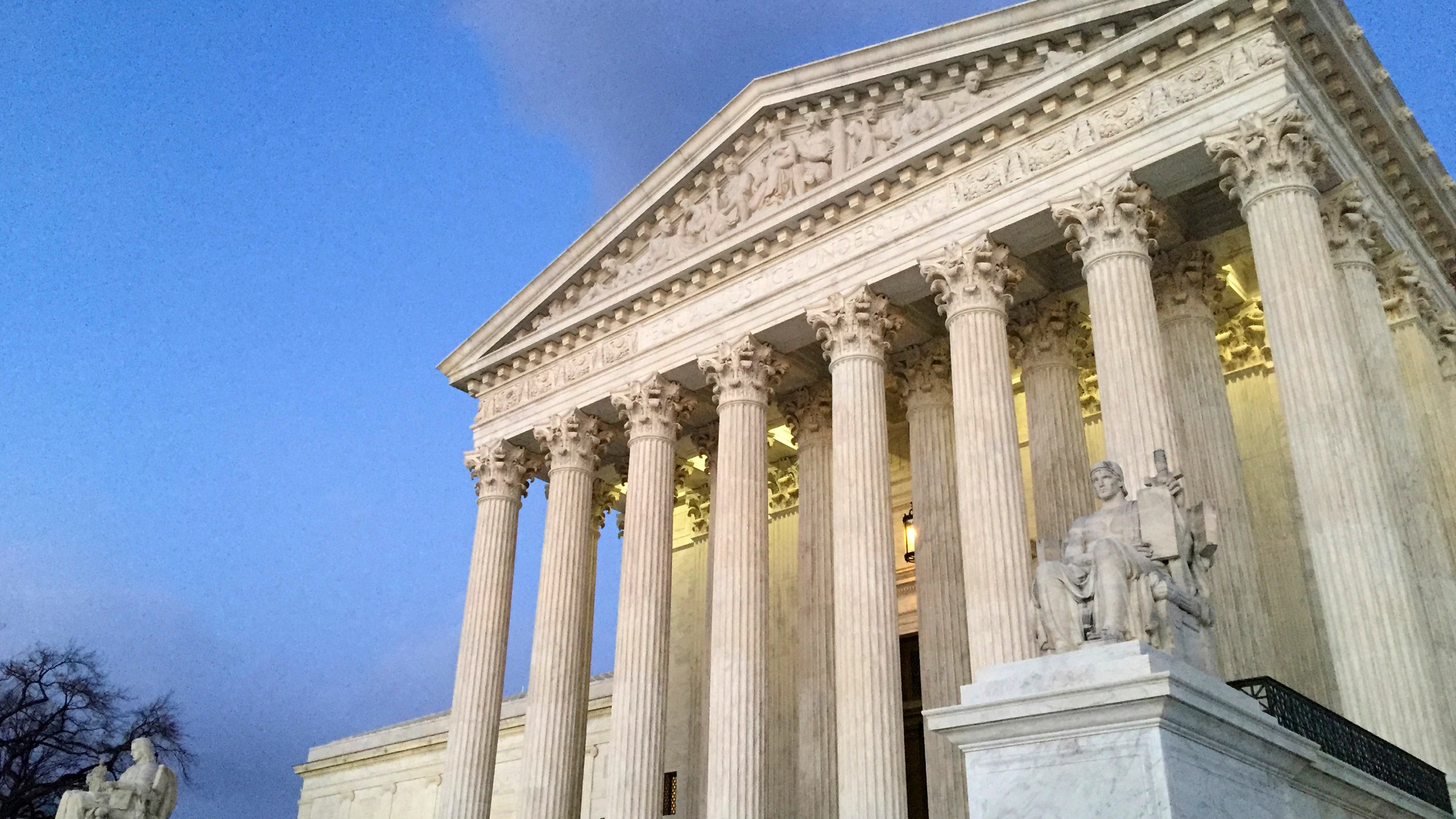 FILE - The Supreme Court at sunset in Washington, Feb. 13, 2016. (AP Photo/Jon Elswick, File)