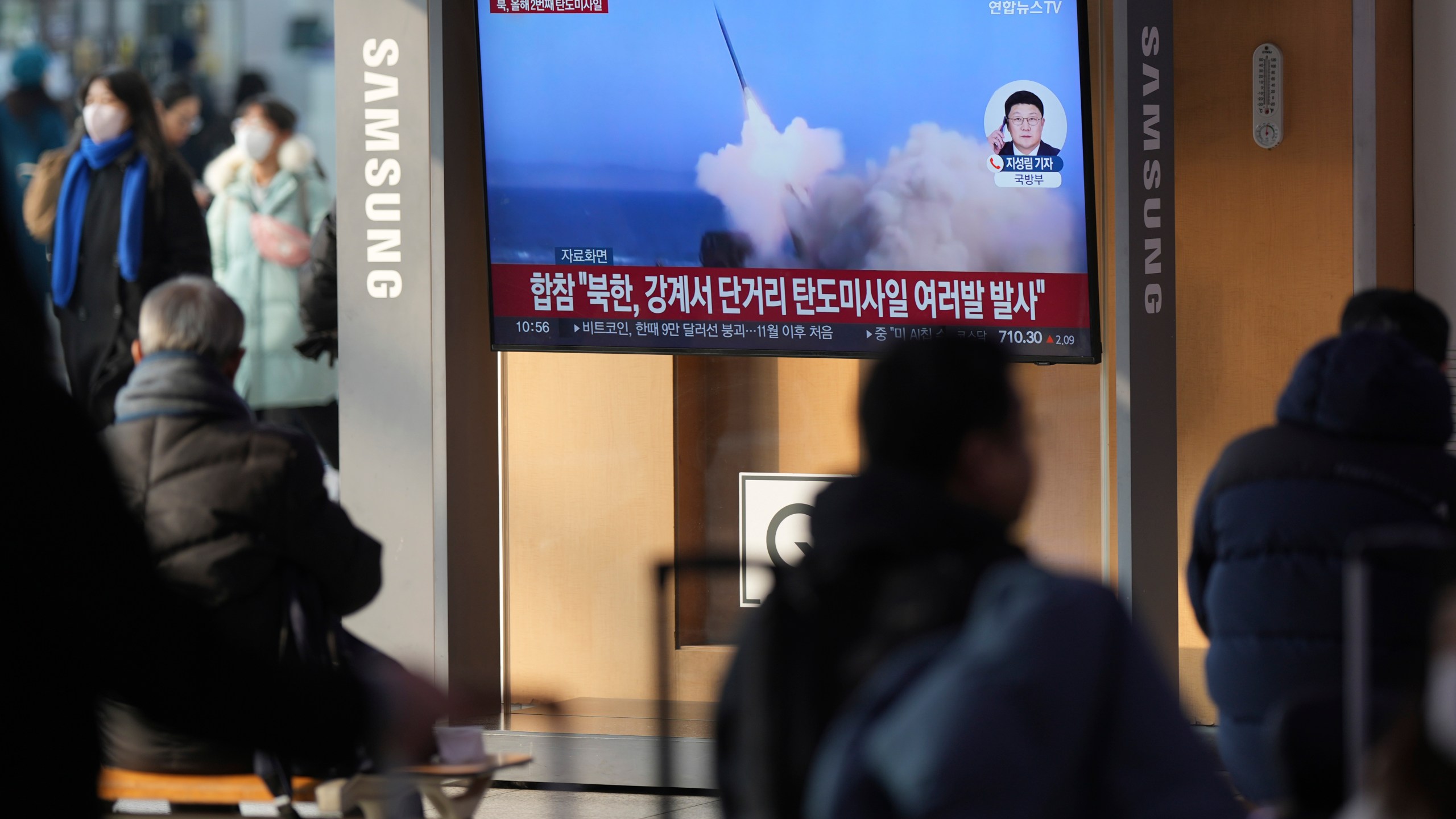 A TV screen shows a report of North Korea's missiles launch with file footage during a news program at the Seoul Railway Station in Seoul, South Korea, Tuesday, Jan. 14, 2025. (AP Photo/Lee Jin-man)