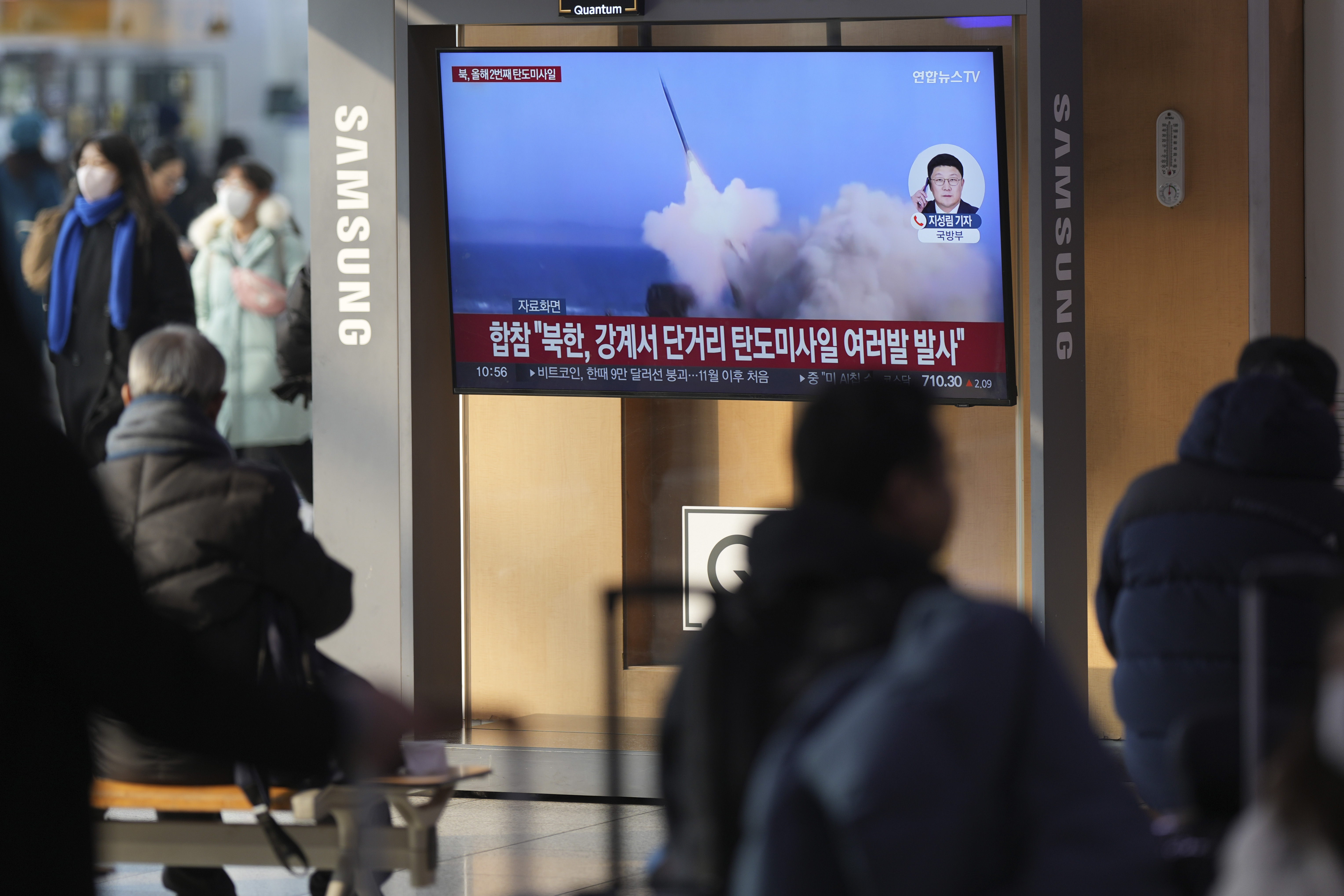 A TV screen shows a report of North Korea's missiles launch with file footage during a news program at the Seoul Railway Station in Seoul, South Korea, Tuesday, Jan. 14, 2025. (AP Photo/Lee Jin-man)