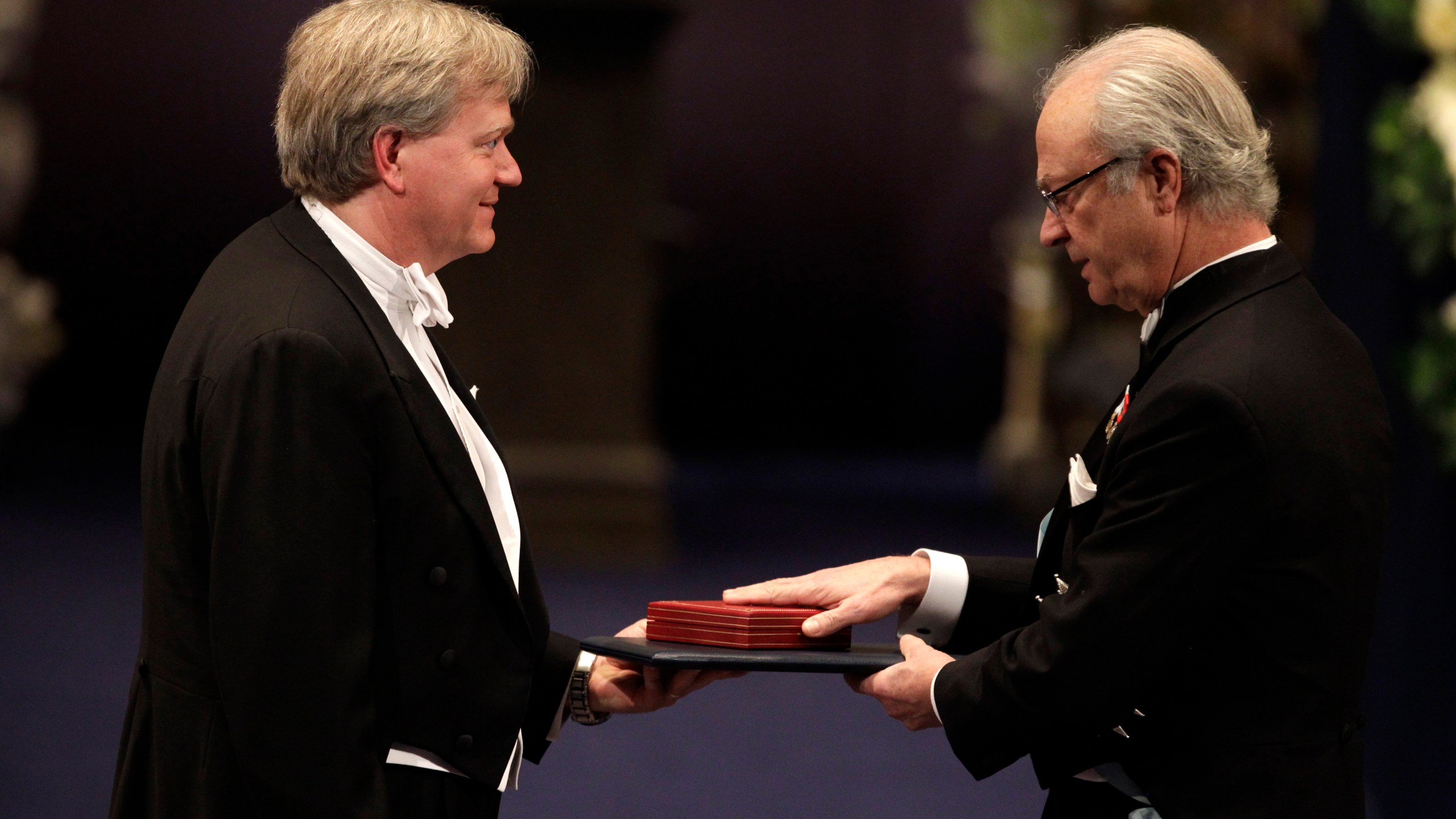 FILE - The 2011 Nobel Prize Laureate for Physics Dr Brian P. Schmidt from Australia receives his Nobel Prize from Sweden's King Carl XVI Gustaf, right, during the Nobel Prize award ceremony at the Stockholm Concert Hall in Stockholm, Sweden, Dec. 10, 2011. (AP Photo/Matt Dunham, File)