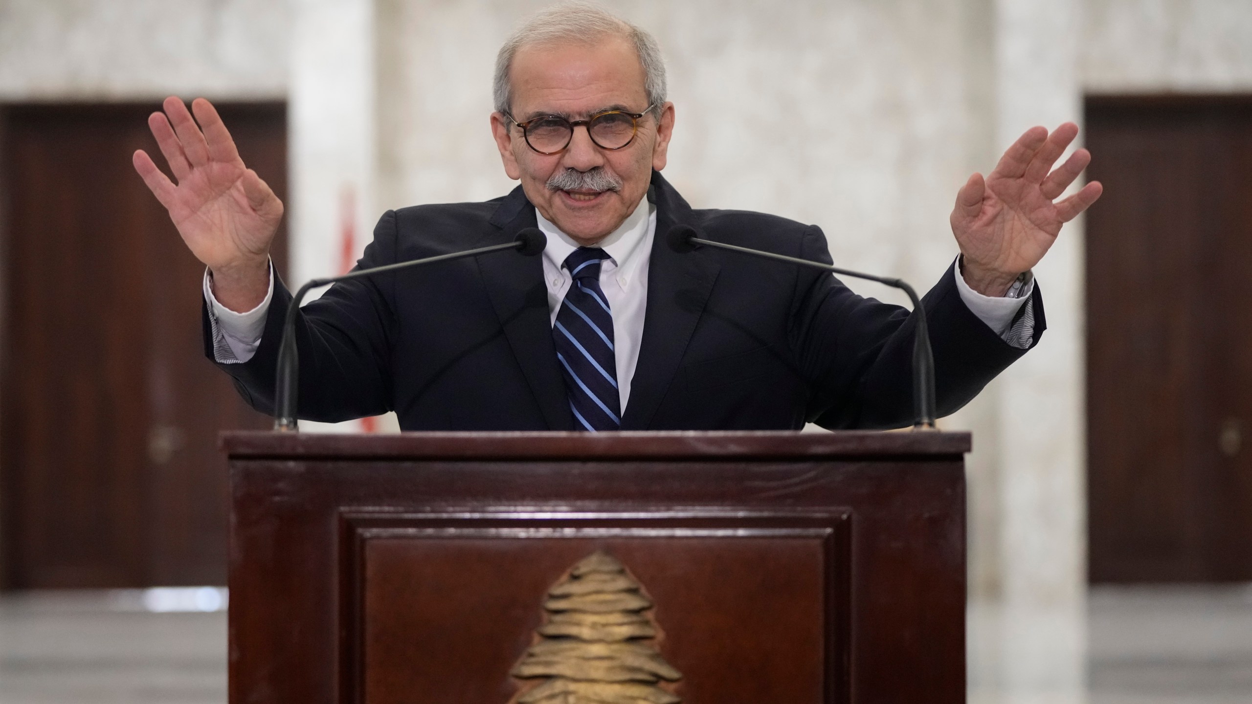 Lebanese Prime Minister-designate Nawaf Salam speaks to journalists after his meeting with Lebanese President Joseph Aoun at the presidential palace in Baabda, east of Beirut, Lebanon, Tuesday, Jan. 14, 2025. (AP Photo/Hassan Ammar)